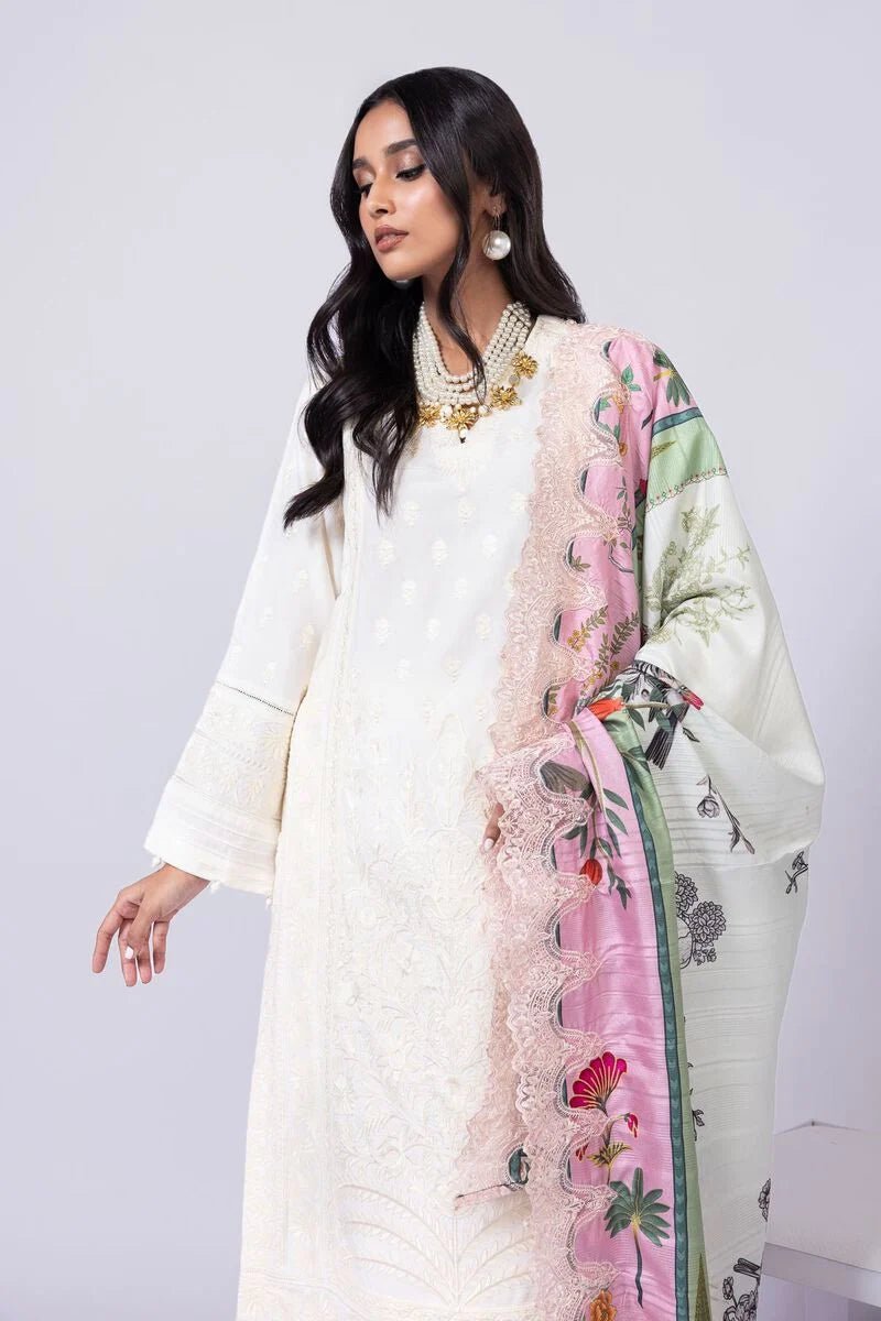 Model wearing Khaadi EST24609A off - white dress with delicate embroidery and a vibrant pink and green printed dupatta. Shop Pakistani clothes online in the UK now.