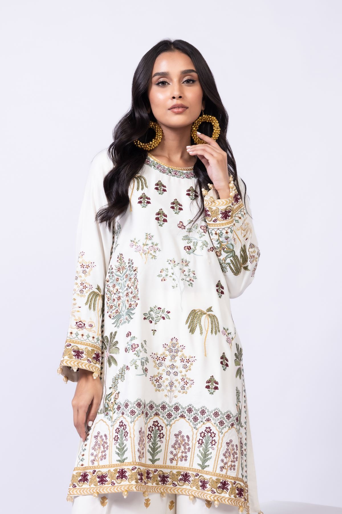 Model wearing Khaadi EST24613B off - white dress with intricate multicolor embroidery. Shop Pakistani clothes online in the UK now.