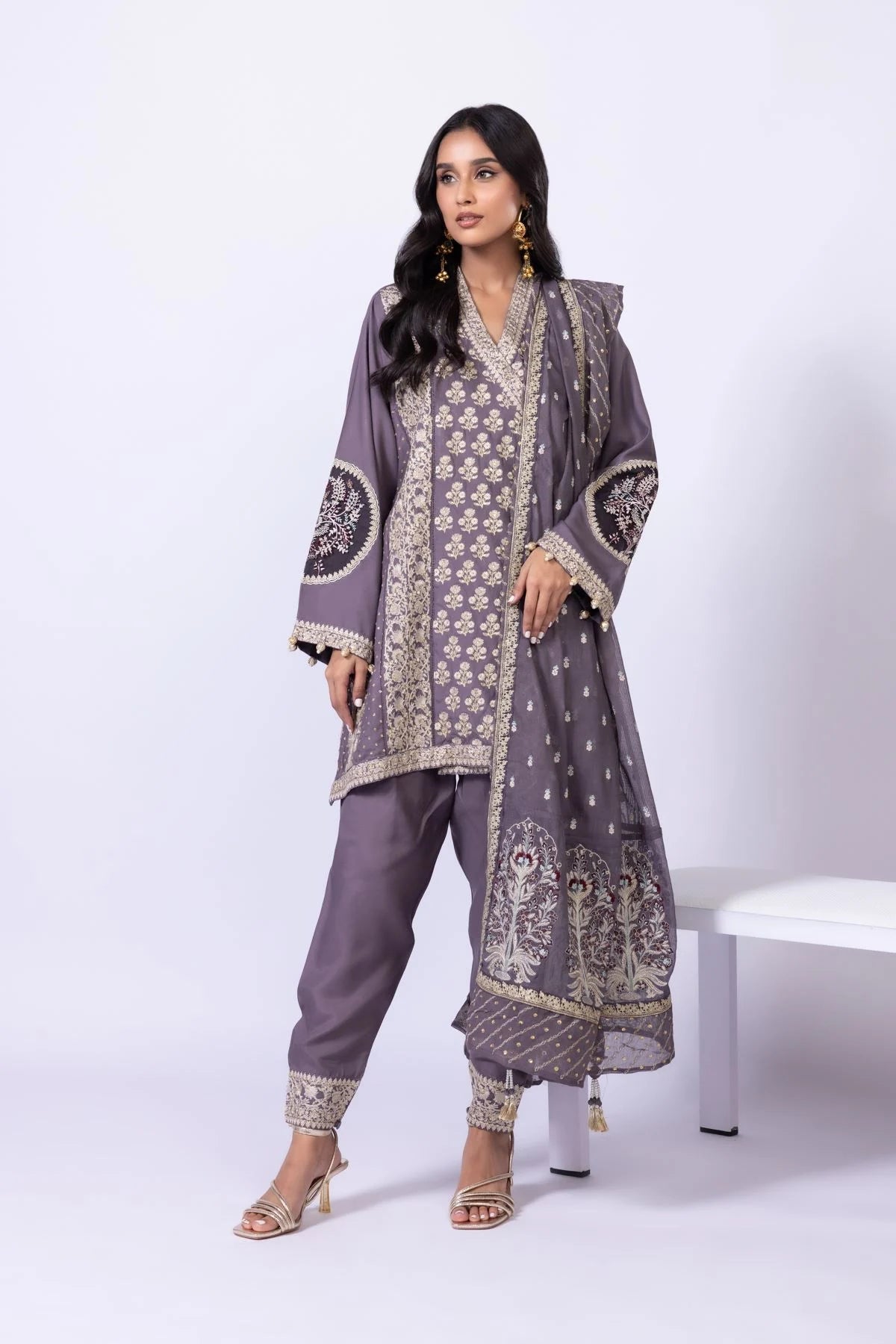 Model wearing Khaadi EST24615B grey dress with intricate embroidery and elegant detailing. Shop Pakistani clothes online in the UK now.