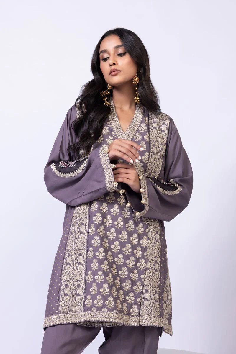 Model wearing Khaadi EST24615B grey dress with intricate embroidery and elegant detailing. Shop Pakistani clothes online in the UK now.