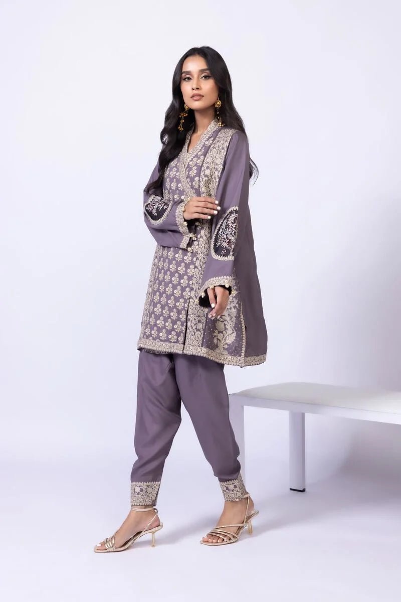 Model wearing Khaadi EST24615B grey dress with intricate embroidery and elegant detailing. Shop Pakistani clothes online in the UK now.