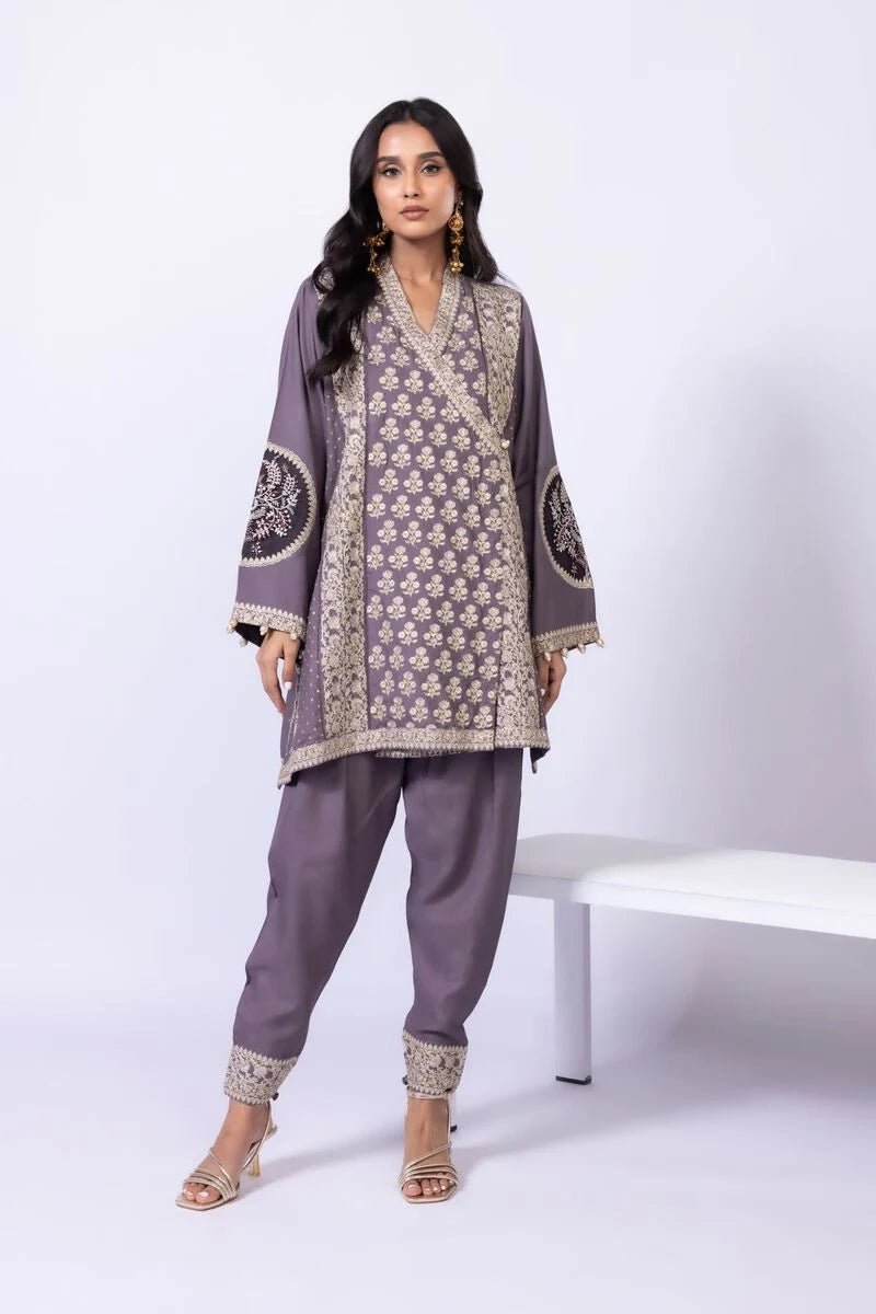 Model wearing Khaadi EST24615B grey dress with intricate embroidery and elegant detailing. Shop Pakistani clothes online in the UK now.