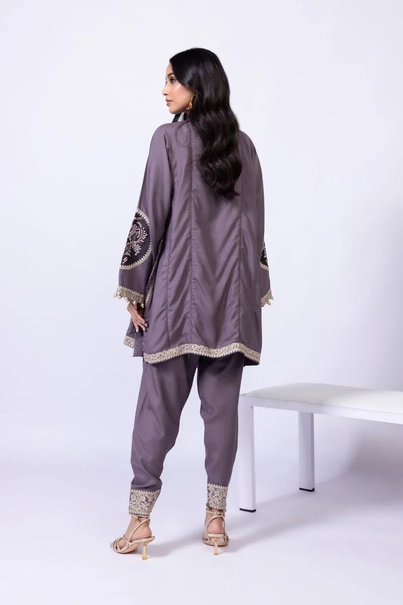 Model wearing Khaadi EST24615B grey dress with intricate embroidery and elegant detailing. Shop Pakistani clothes online in the UK now.