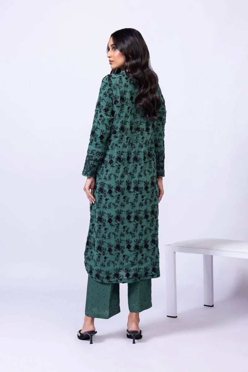 Model wearing Khaadi EST24635A green dress with black embroidered details and chiffon dupatta. Shop Pakistani clothes online in the UK now.