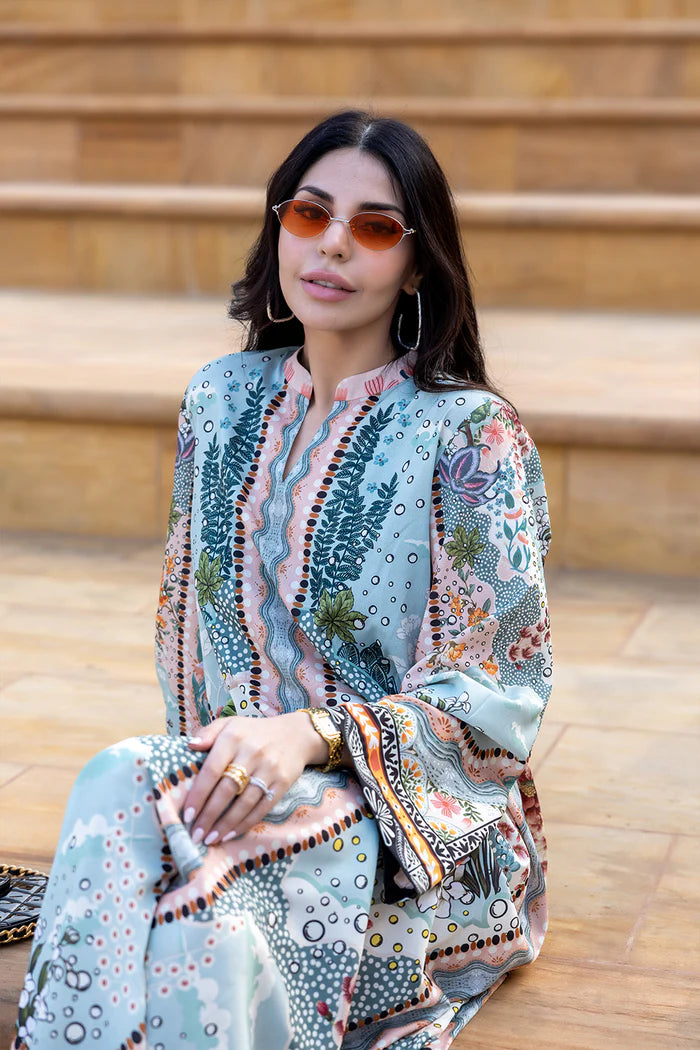 Model wearing multicolour printed long kaftan-style dress with flared sleeves from Saira Rizwan, Pakistani luxury pret, Pakistani clothes online in UK.