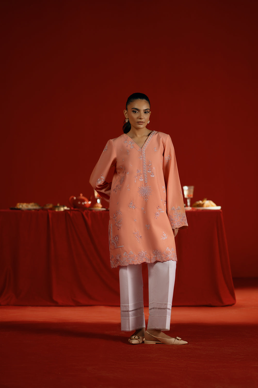 Model wearing peach embroidered outfit from Saira Rizwan Joolie | PEACH - JBP25-05, elegant Pakistani luxury pret available online in UK.