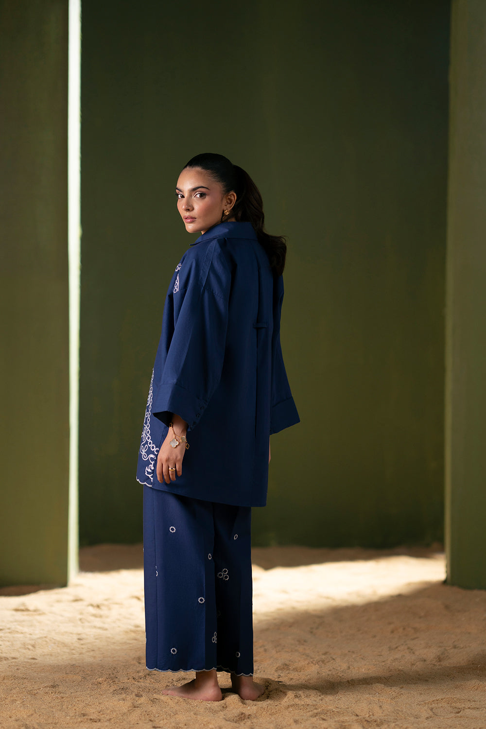 Model wearing navy blue embroidered outfit from Saira Rizwan Joolie | BLUE-JBP25-03, Pakistani luxury pret available online in UK.