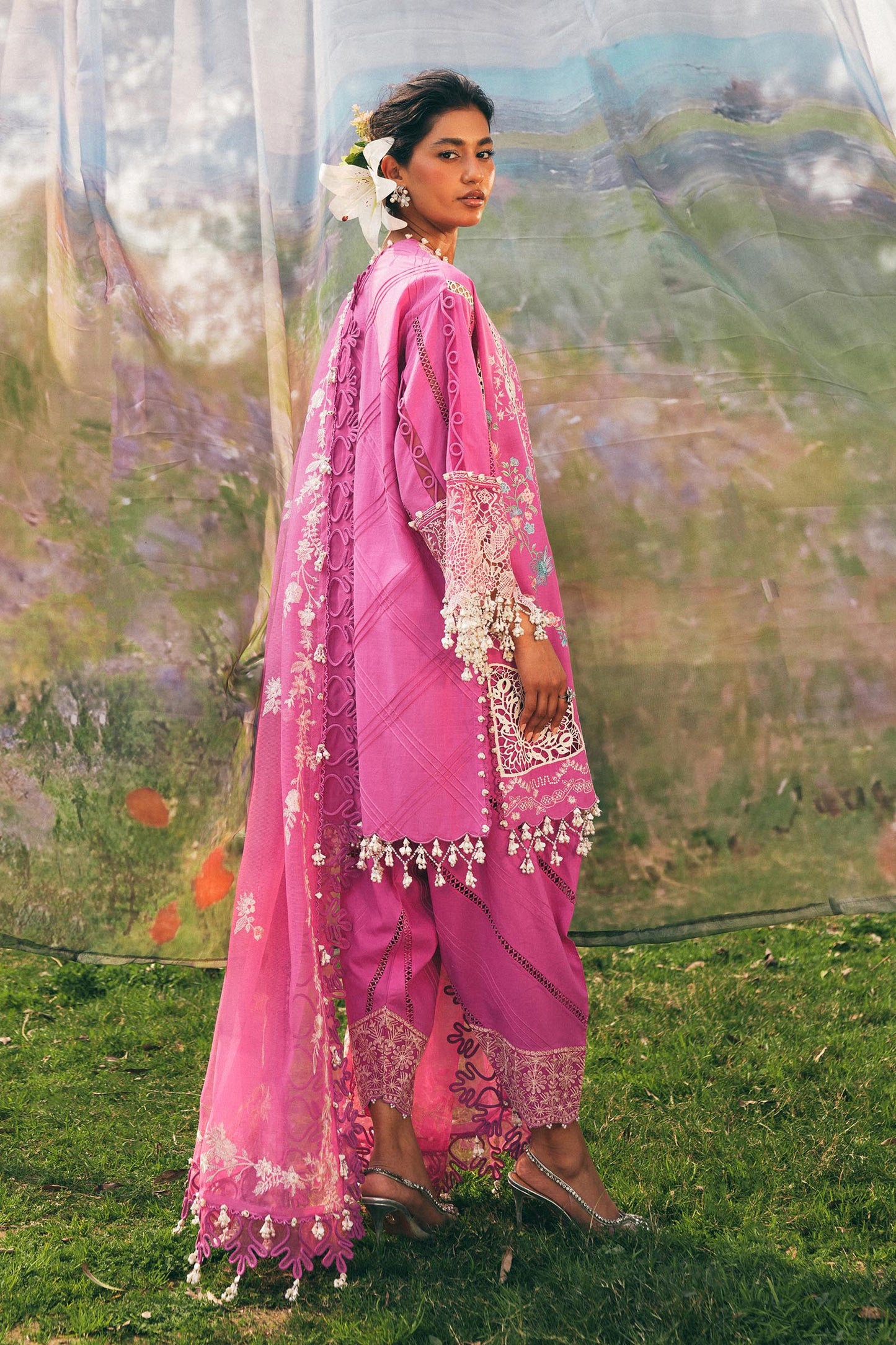 Model wearing bright pink embroidered outfit from Sana Safinaz, Luxury Lawn '25, perfect for Pakistani clothes online in UK and luxury pret.