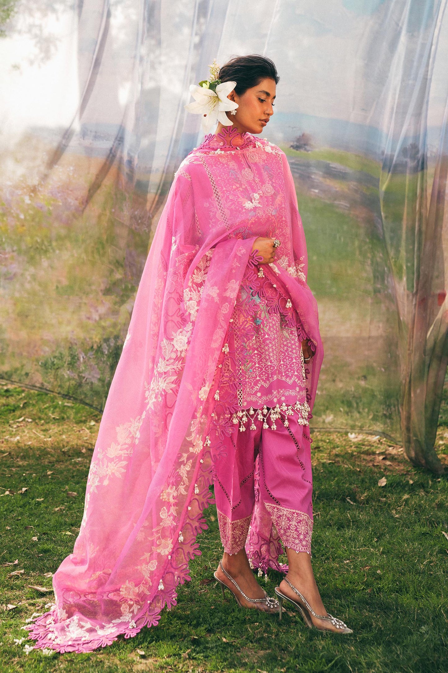 Model wearing bright pink embroidered outfit from Sana Safinaz, Luxury Lawn '25, perfect for Pakistani clothes online in UK and luxury pret.