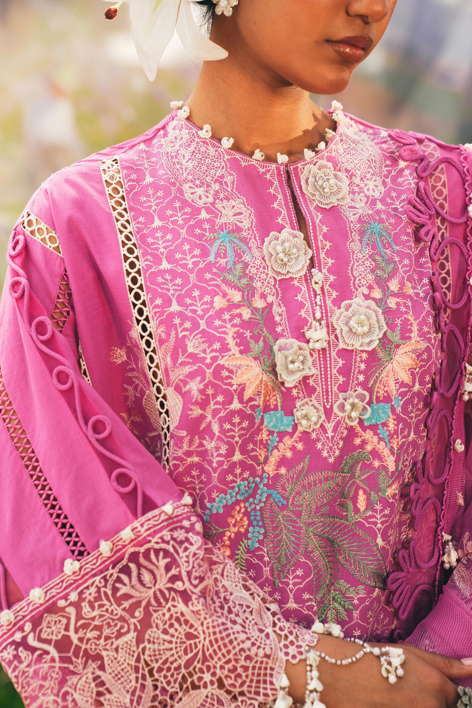 Model wearing bright pink embroidered outfit from Sana Safinaz, Luxury Lawn '25, perfect for Pakistani clothes online in UK and luxury pret.