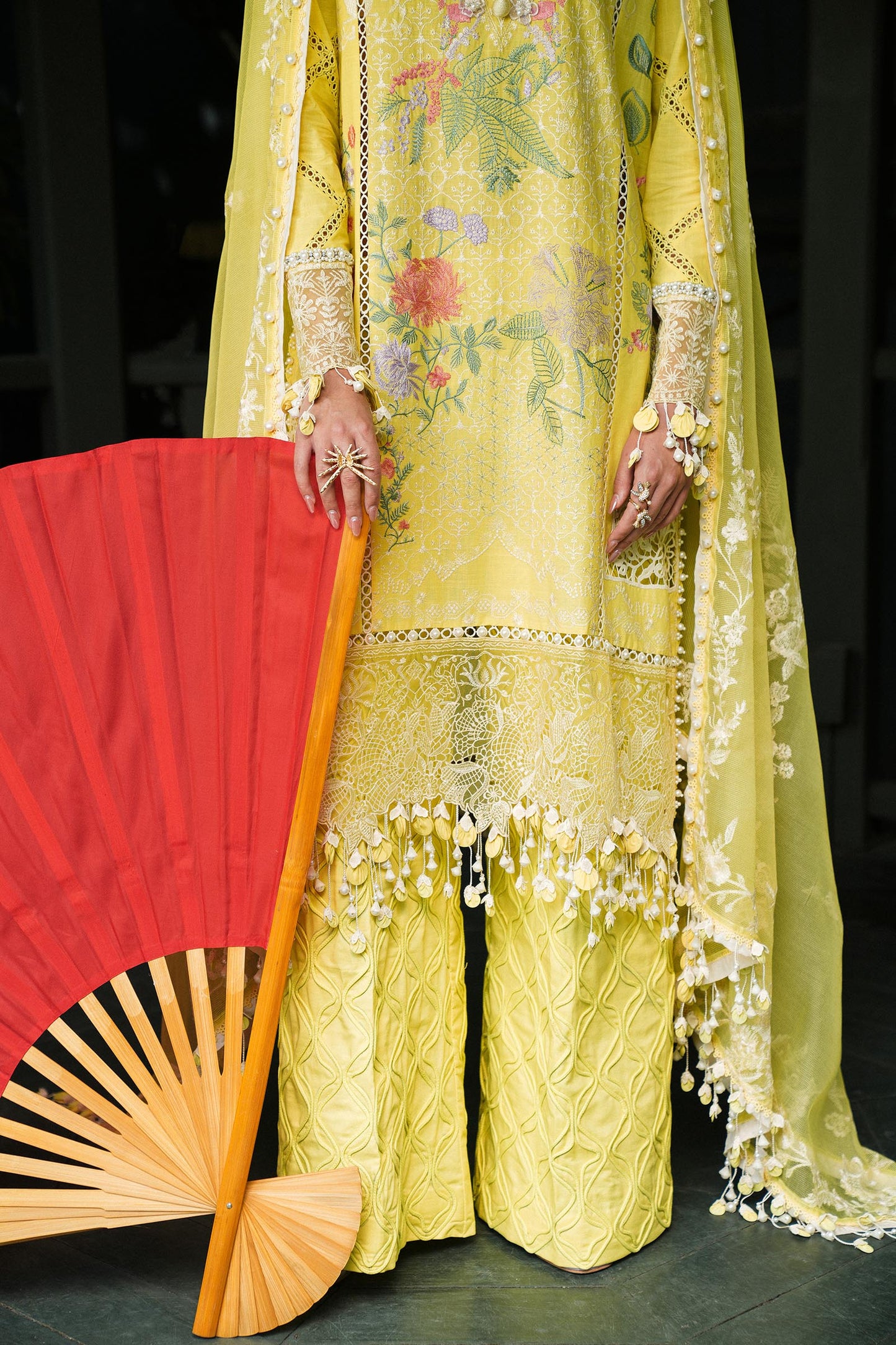 Model wearing lemon yellow embroidered outfit from Sana Safinaz, Luxury Lawn '25, ideal for Pakistani clothes online in UK and luxury pret.
