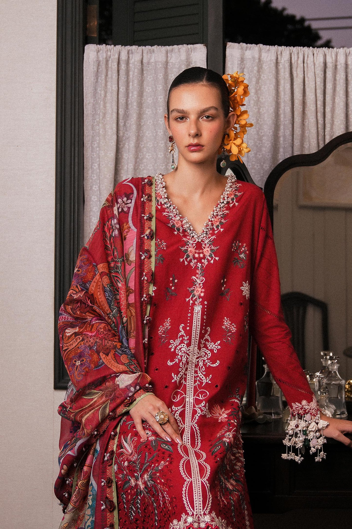 Model wearing deep red embroidered dress with multicolor dupatta from Sana Safinaz Luxury Lawn '25, Pakistani clothes online in UK.