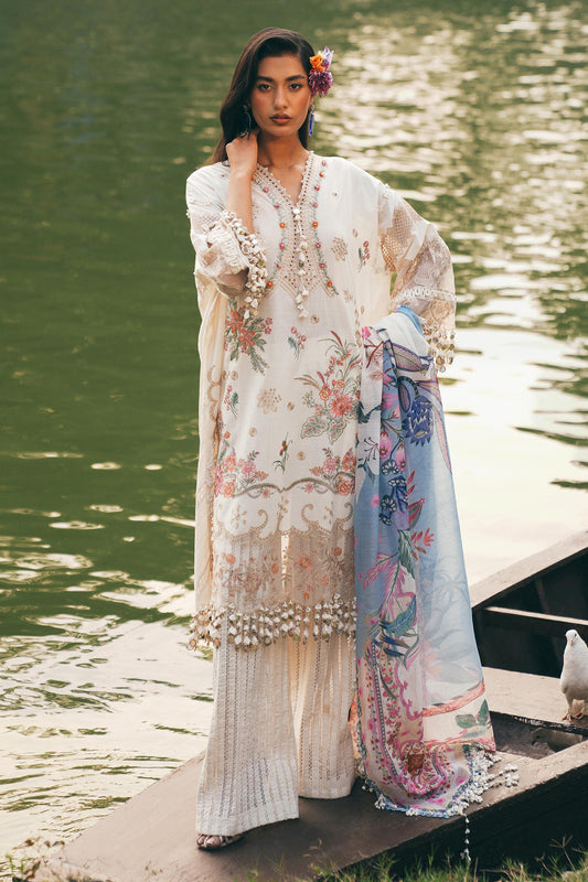 Model wearing ivory and pastel floral embroidered dress with printed dupatta from Sana Safinaz Luxury Lawn '25, Pakistani clothes online in UK.