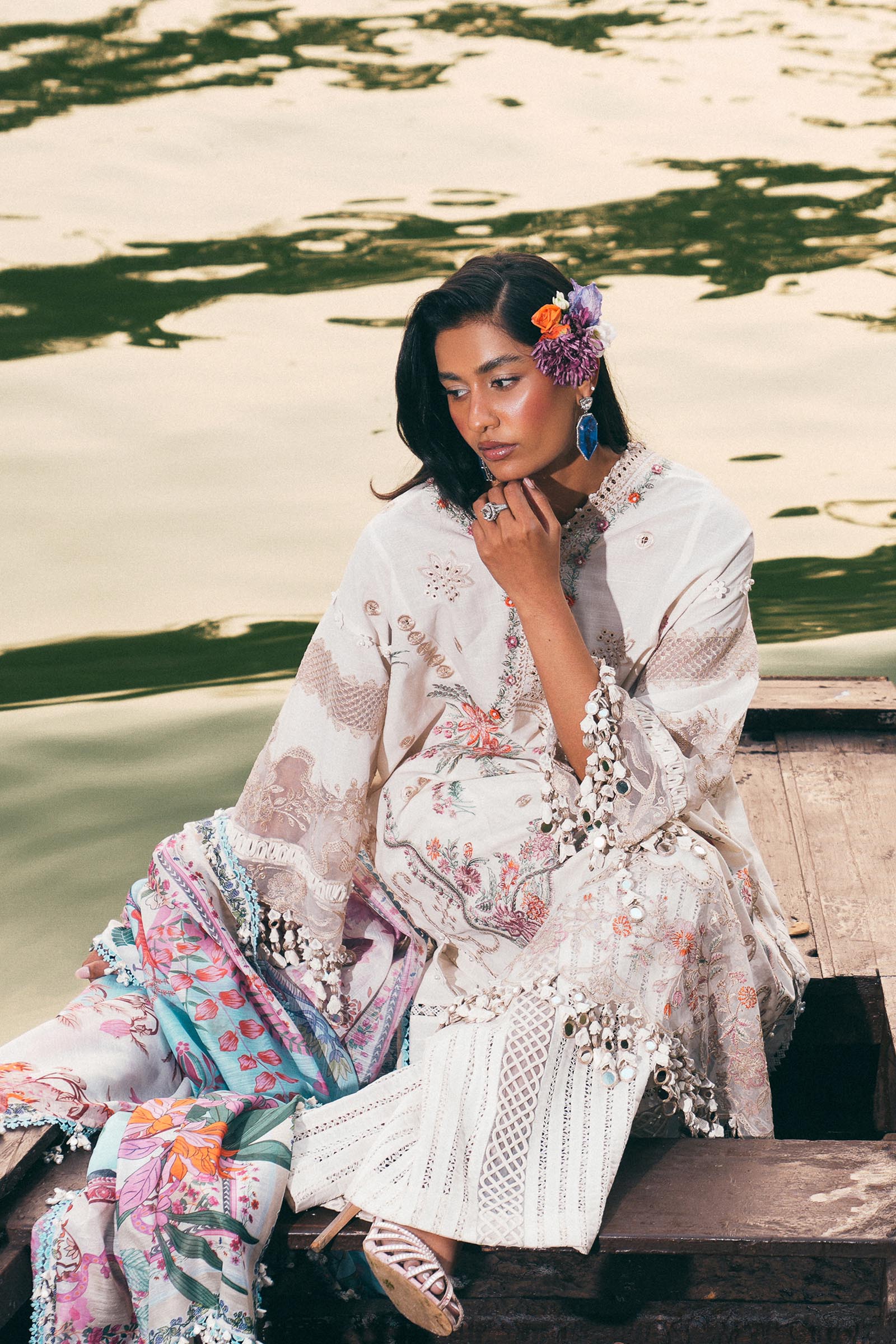 Model wearing ivory and pastel floral embroidered dress with printed dupatta from Sana Safinaz Luxury Lawn '25, Pakistani clothes online in UK.