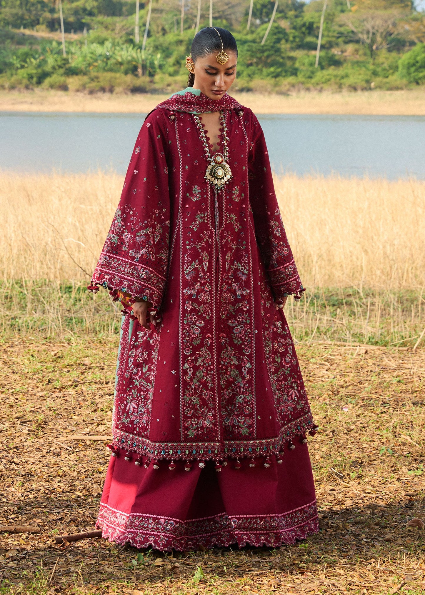 Model wearing Hussain Rehar Luxury Lawn '25 Mahogany in maroon with intricate embroidery. Shop Pakistani luxury pret online in the UK.