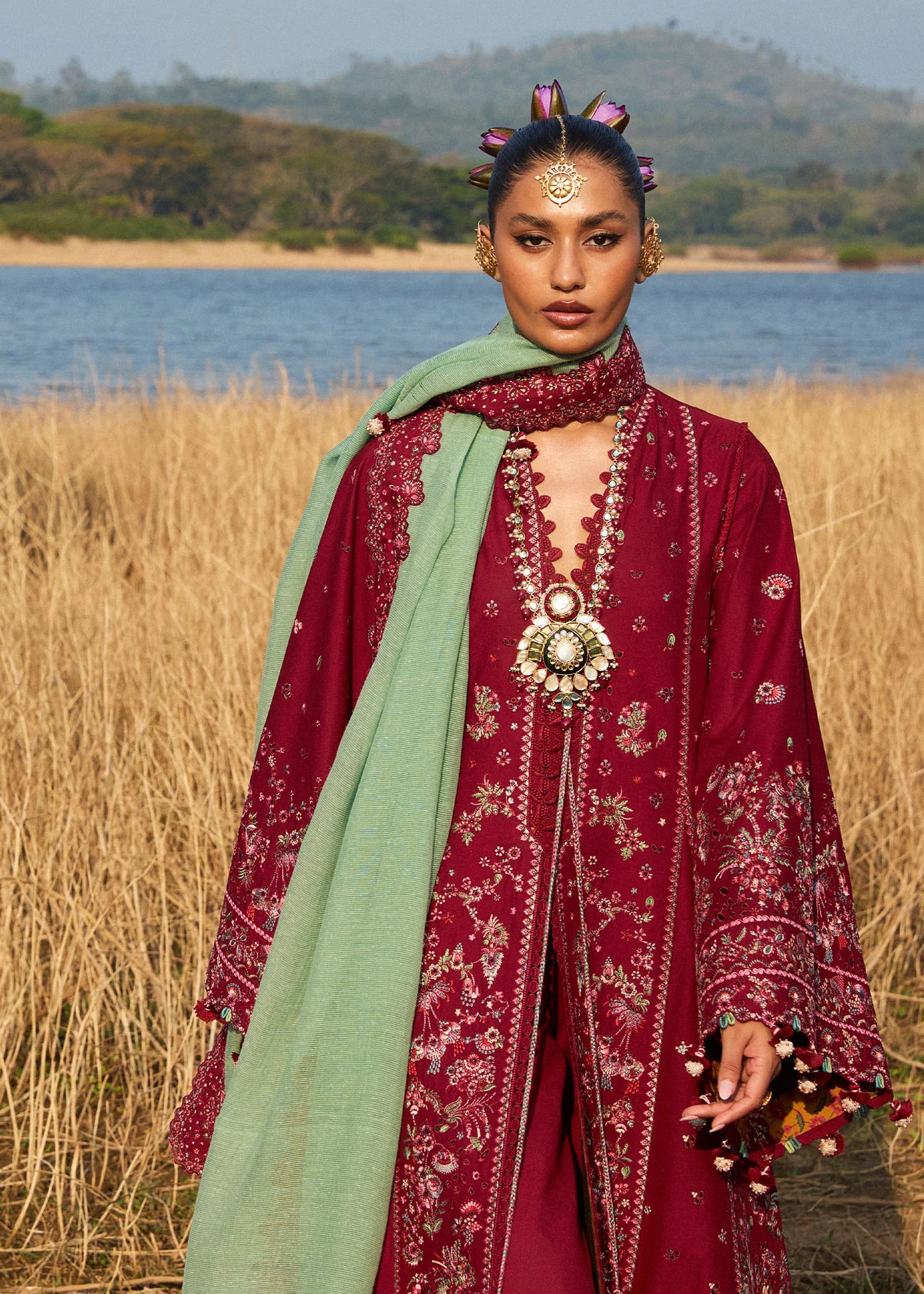 Model wearing Hussain Rehar Luxury Lawn '25 Mahogany in maroon with intricate embroidery. Shop Pakistani luxury pret online in the UK.