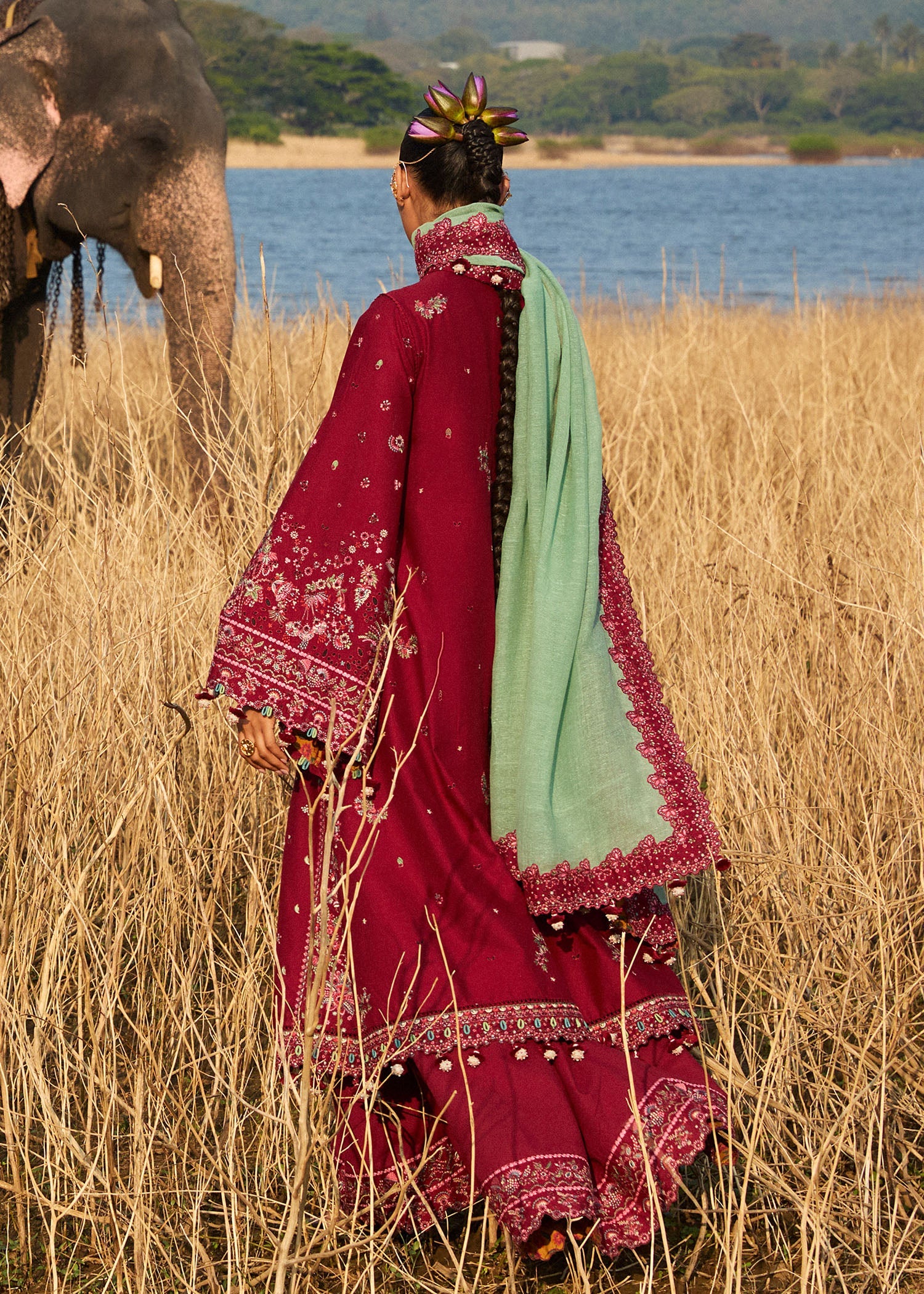 Model wearing Hussain Rehar Luxury Lawn '25 Mahogany in maroon with intricate embroidery. Shop Pakistani luxury pret online in the UK.