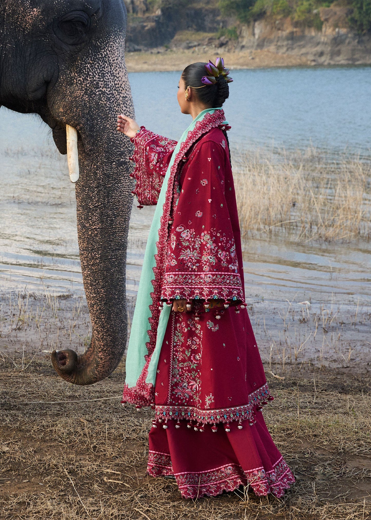 Model wearing Hussain Rehar Luxury Lawn '25 Mahogany in maroon with intricate embroidery. Shop Pakistani luxury pret online in the UK.