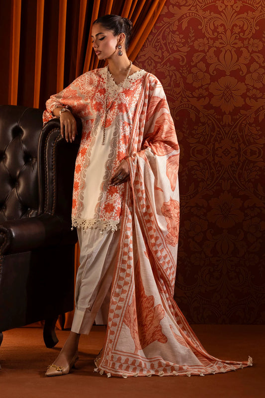 Model wearing a 3-piece cream and orange suit featuring a digitally printed linen front, back, and sleeves with intricate orange floral patterns. Styled with an embroidered organza neckline and sleeve borders, a printed khaddar dupatta, and dyed cotton pants for an elegant look. Part of the Sana Safinaz Muzlin Winter 2024 collection, available online in the UK.