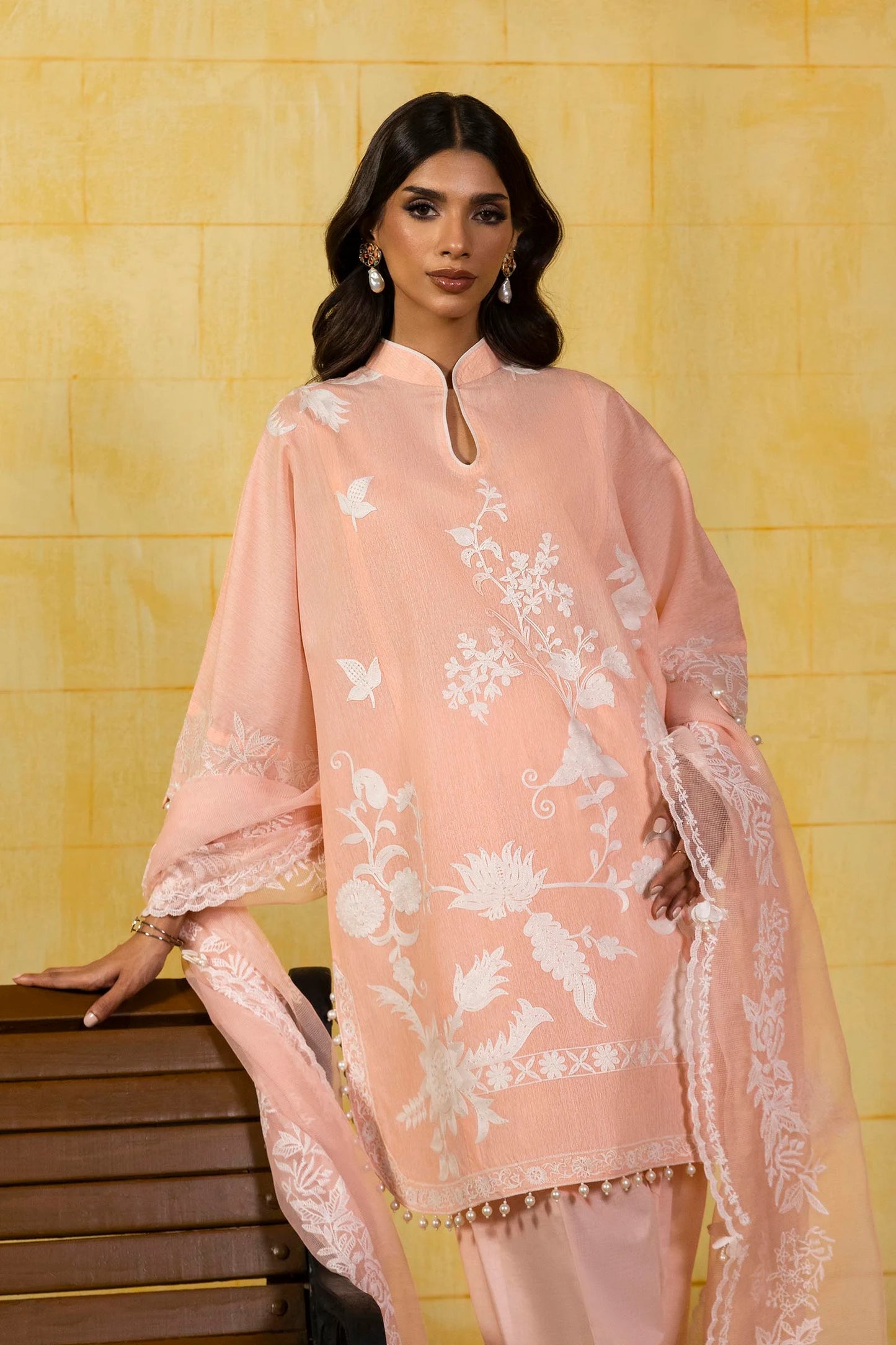Model wearing peach Sana Safinaz M251-015A-3CT outfit with white floral embroidery and lace dupatta, Pakistani Luxury pret in UK.