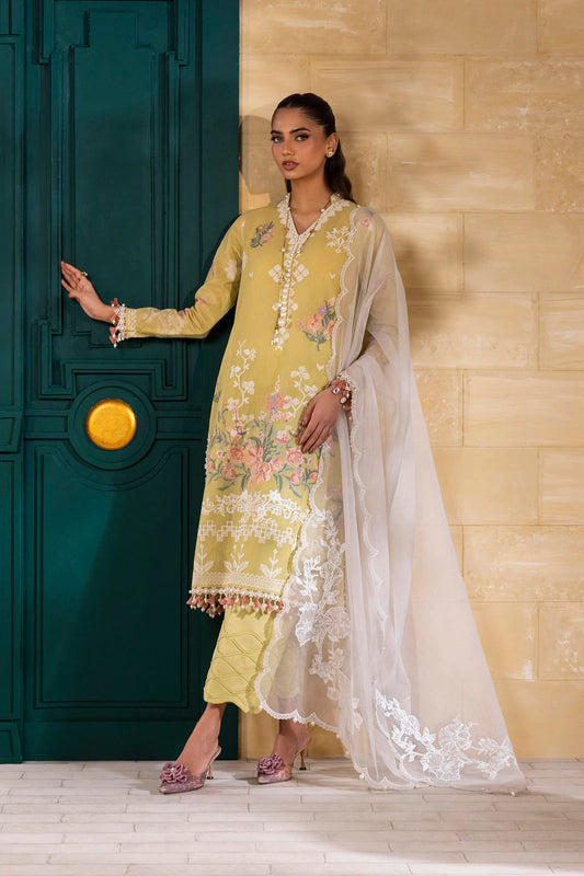 Model wearing mustard yellow Sana Safinaz M251-016B-3CT outfit with floral embroidery and white dupatta, Pakistani Luxury pret in UK.