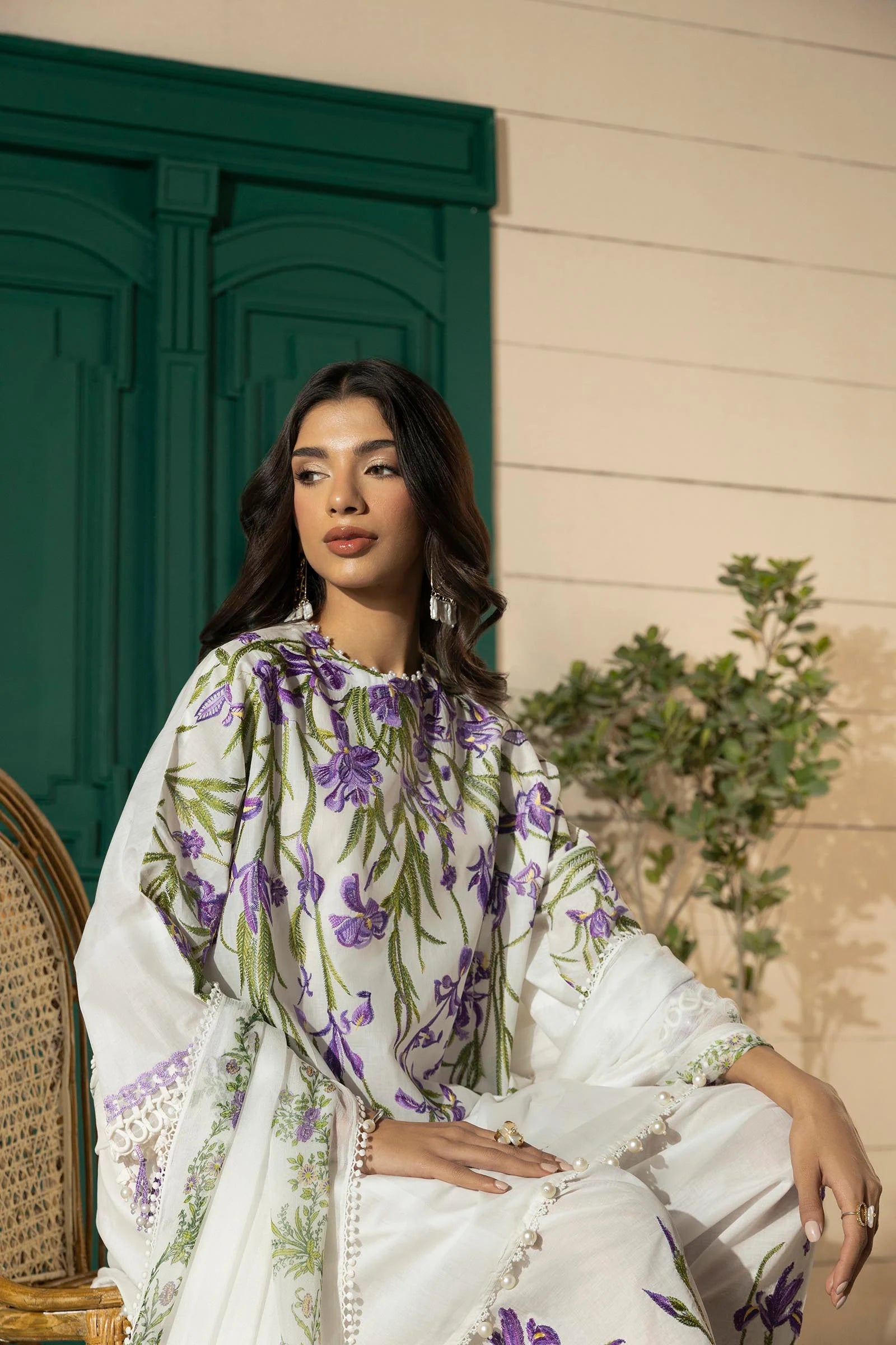 Model wearing white Sana Safinaz M251-017A-3CJ outfit with purple floral embroidery and printed dupatta, Pakistani Luxury pret in UK.