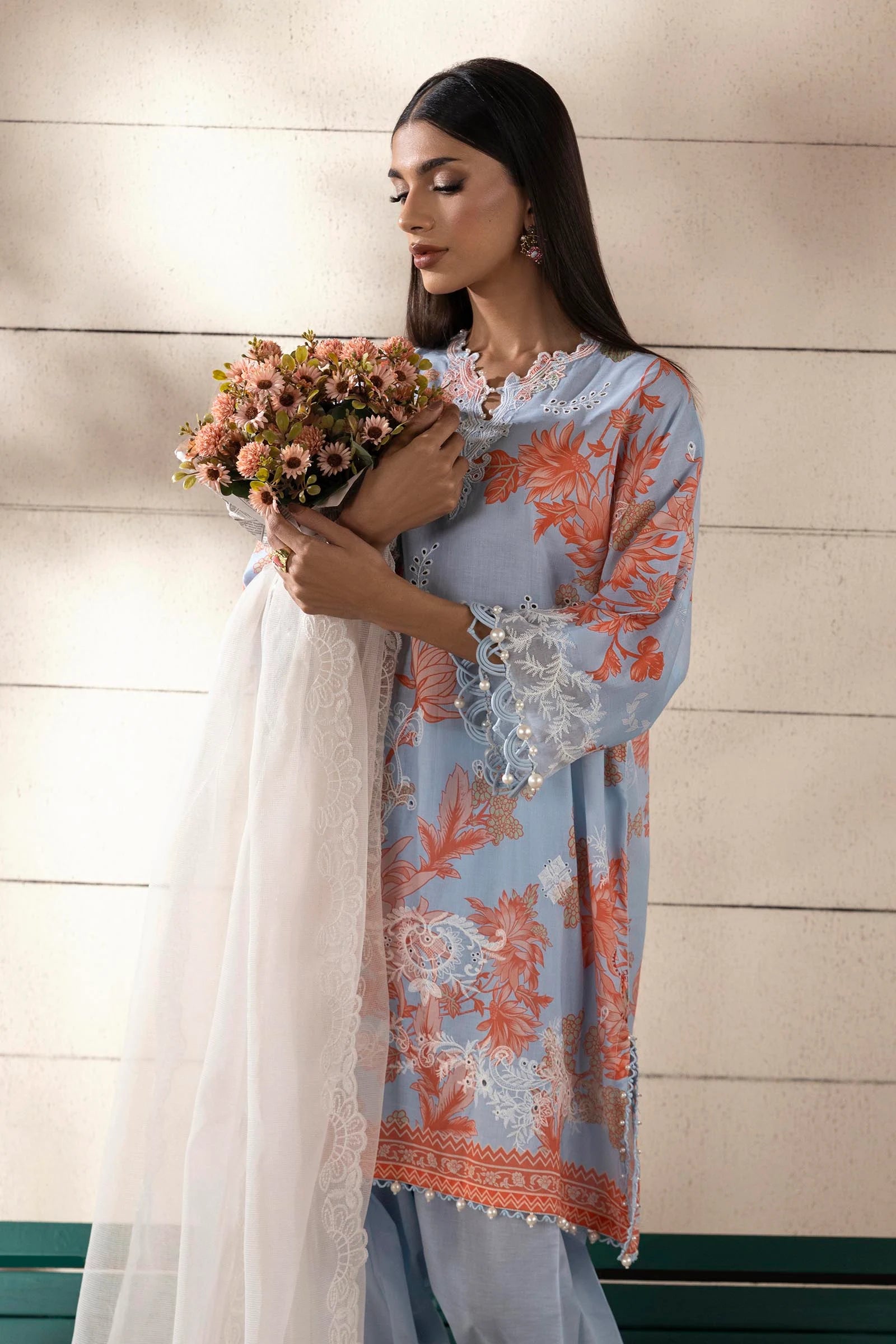 Model wearing sky blue Sana Safinaz M251-020B-3CS outfit with peach floral embroidery and white lace dupatta, Pakistani Luxury pret online in UK.
