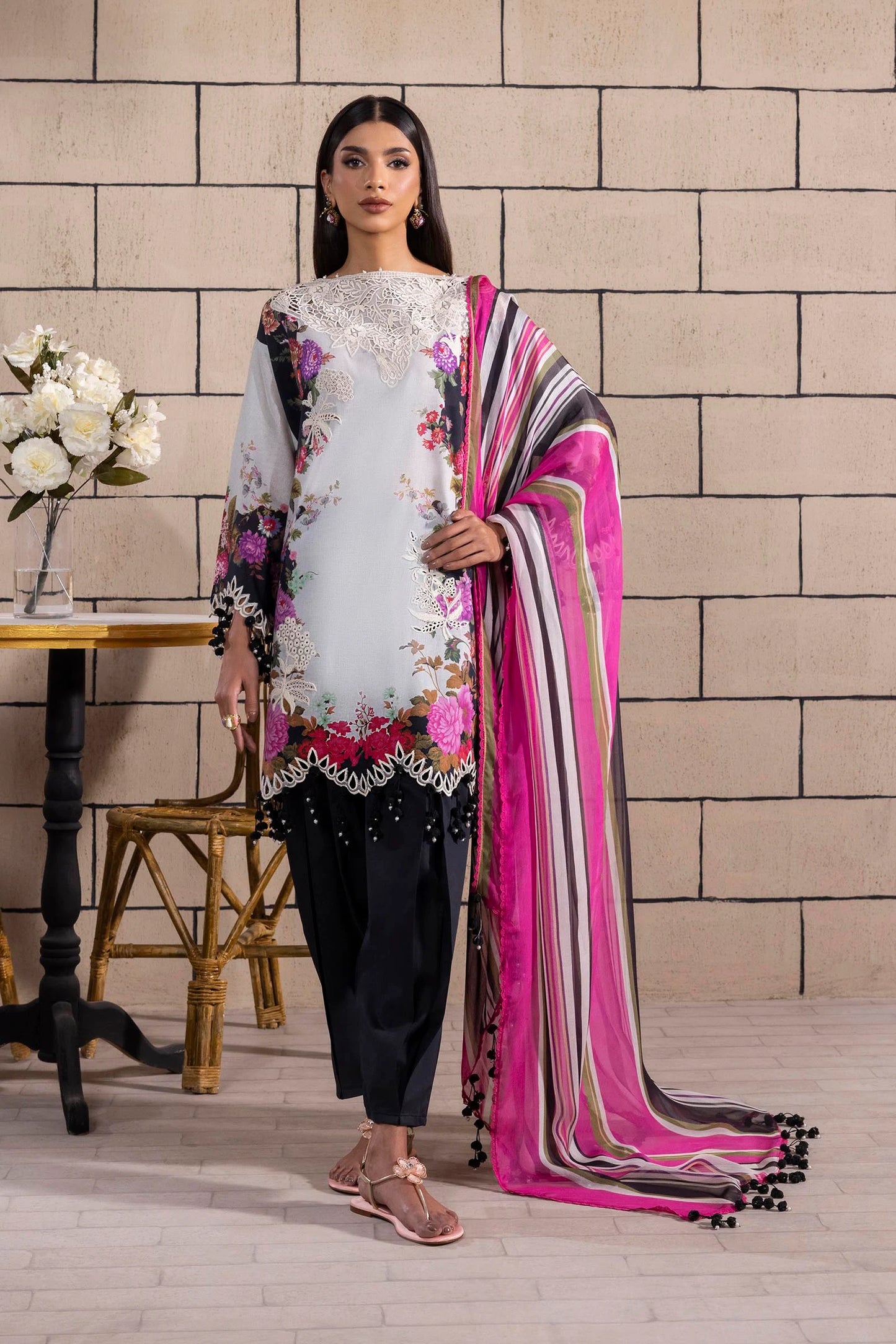 Model wearing white and black Sana Safinaz M251-022A-3CI outfit with floral embroidery and pink striped dupatta, Pakistani Luxury pret, Pakistani clothes online in UK.