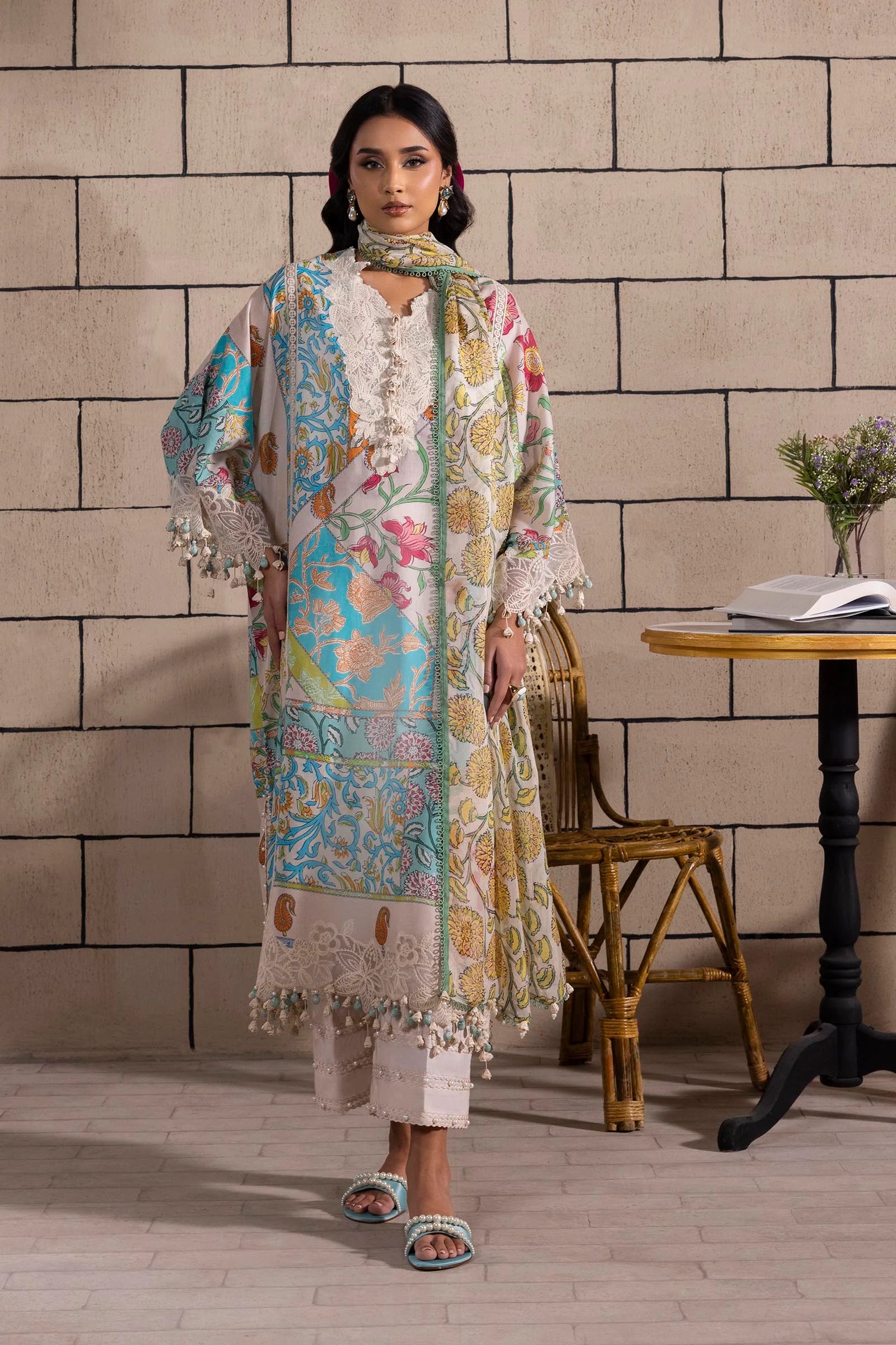 Model wearing multicolor Sana Safinaz M251-027B-3CI outfit with vibrant prints and ivory base, Pakistani Luxury pret, Pakistani clothes online in UK.