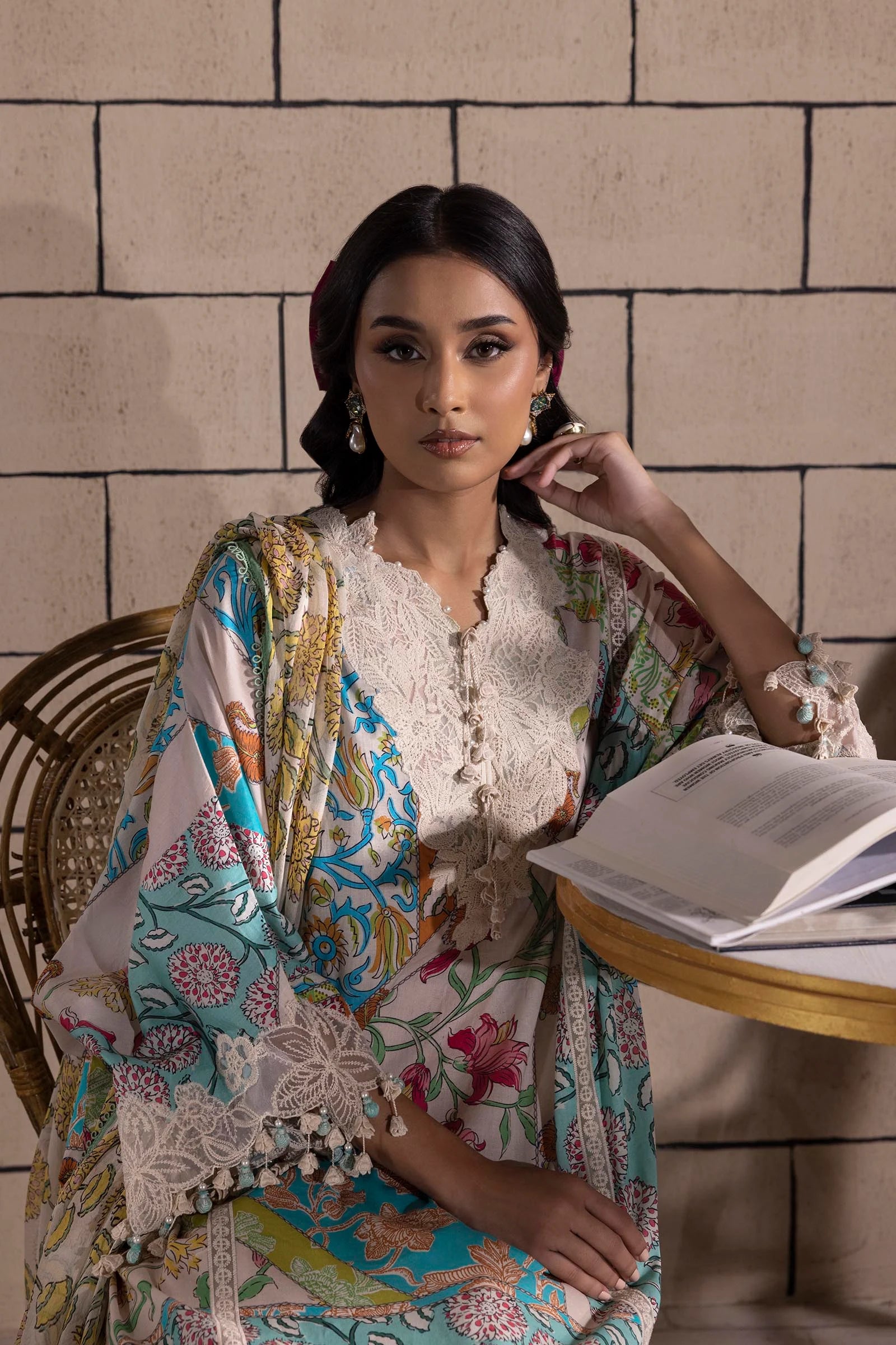 Model wearing multicolor Sana Safinaz M251-027B-3CI outfit with vibrant prints and ivory base, Pakistani Luxury pret, Pakistani clothes online in UK.