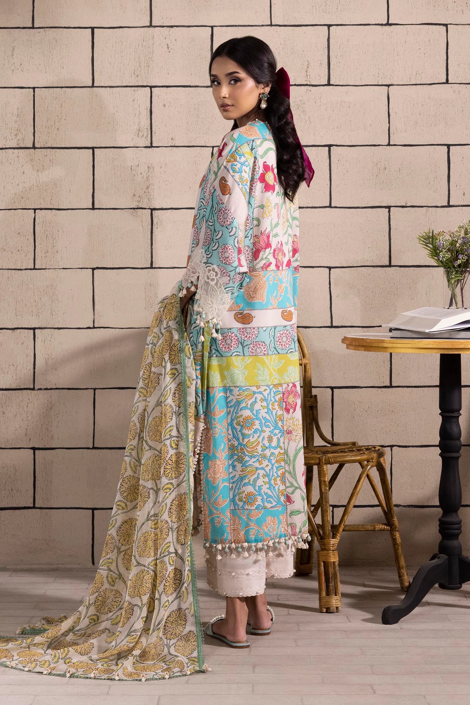 Model wearing multicolor Sana Safinaz M251-027B-3CI outfit with vibrant prints and ivory base, Pakistani Luxury pret, Pakistani clothes online in UK.