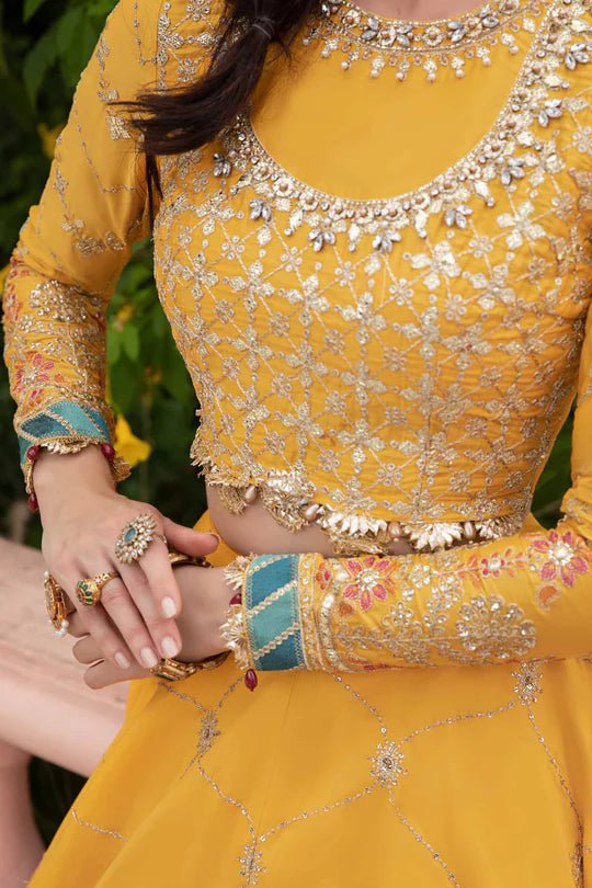 Model wearing Maria B Yellow CST - 705 dress, showcasing Pakistani clothes in UK