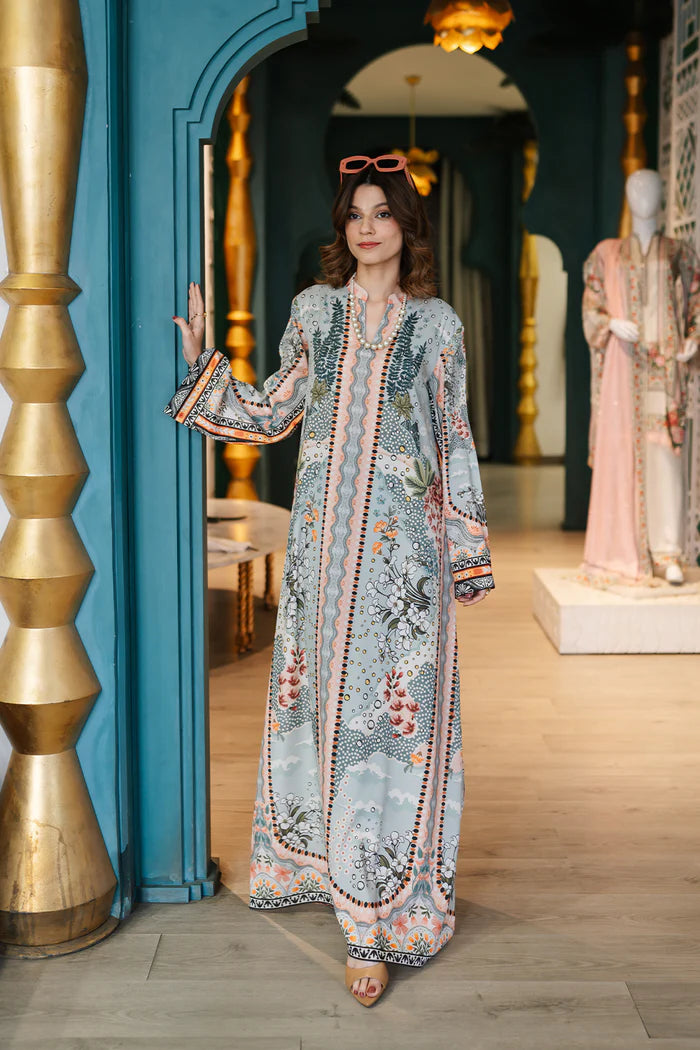 Model wearing multicolour printed long kaftan-style dress with flared sleeves from Saira Rizwan, Pakistani luxury pret, Pakistani clothes online in UK.
