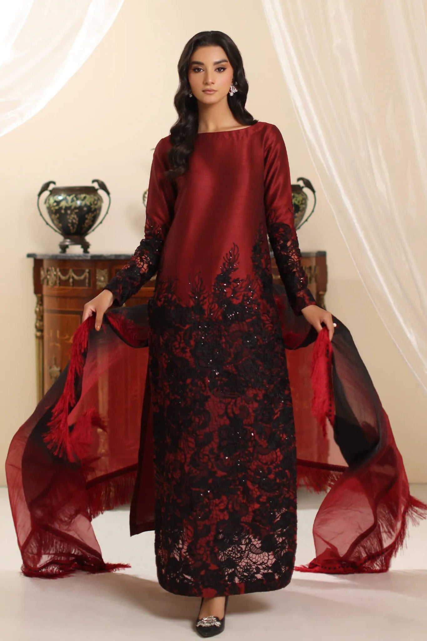 Model wearing Musferah Saad Dark Rose dress in rich red and black from the Amor a La Vida collection, ideal for Pakistani wedding clothes online in the UK.