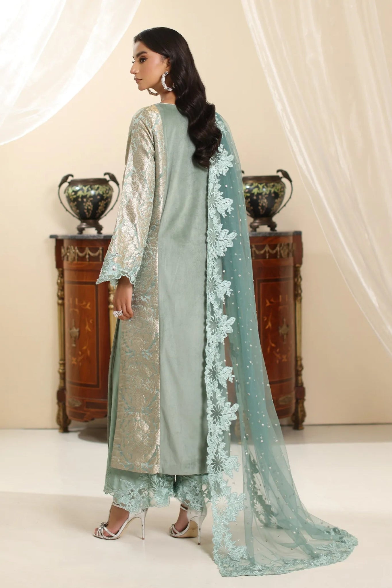 Model wearing Musferah Saad Sage Queen dress from the Amor a La Vida collection in light sage with intricate embroidery, perfect for Pakistani wedding clothes online in the UK.