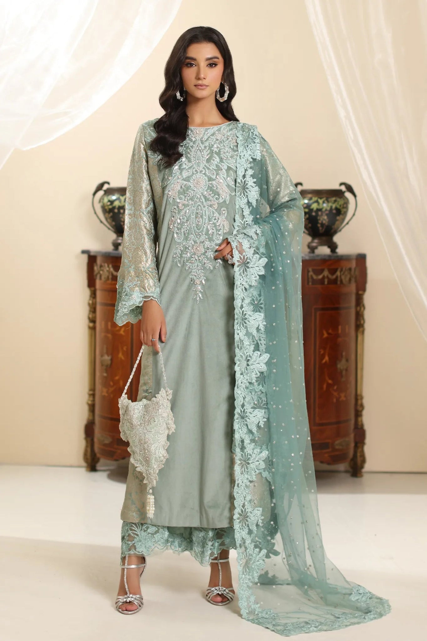 Model wearing Musferah Saad Sage Queen dress from the Amor a La Vida collection in light sage with intricate embroidery, perfect for Pakistani wedding clothes online in the UK.