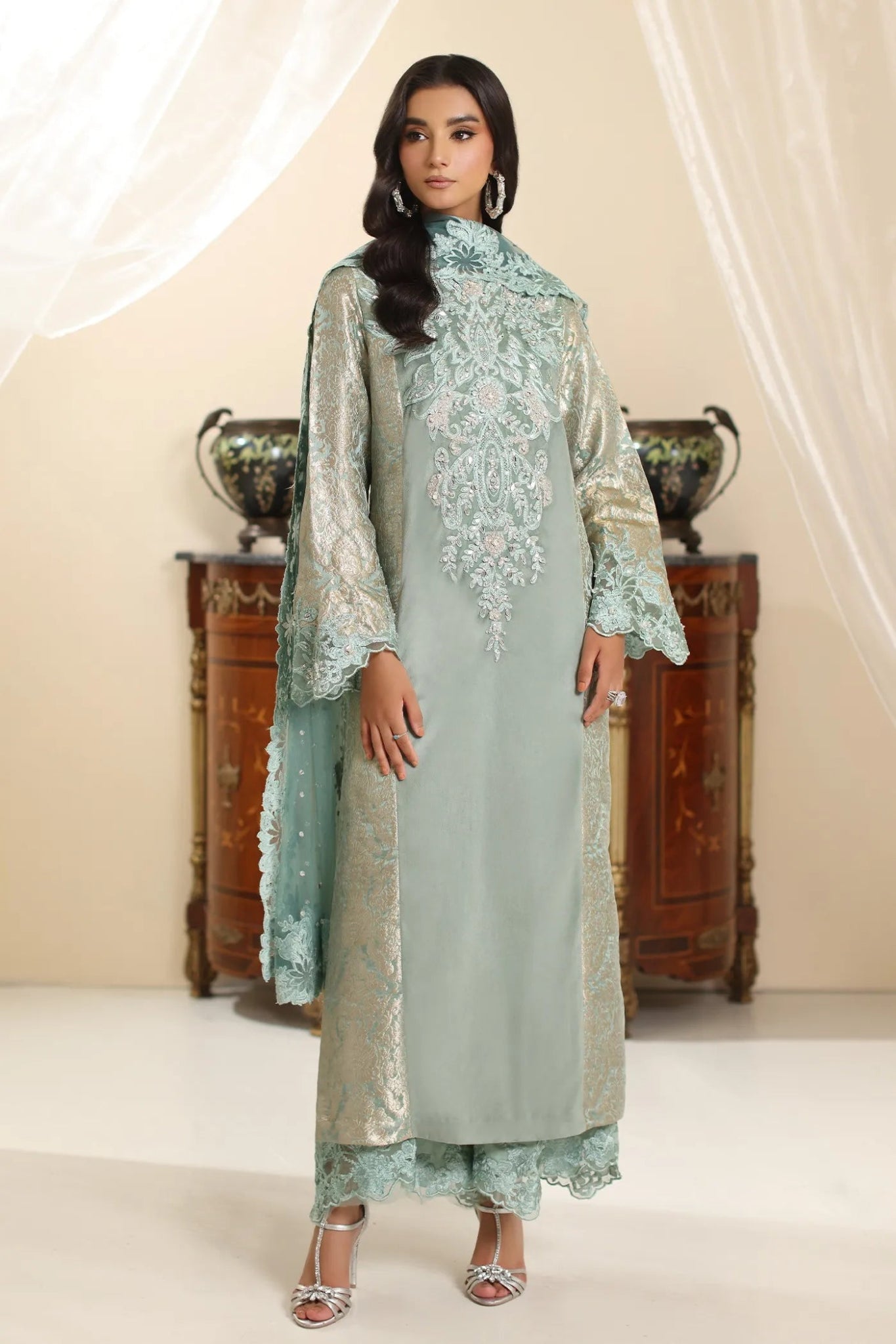 Model wearing Musferah Saad Sage Queen dress from the Amor a La Vida collection in light sage with intricate embroidery, perfect for Pakistani wedding clothes online in the UK.