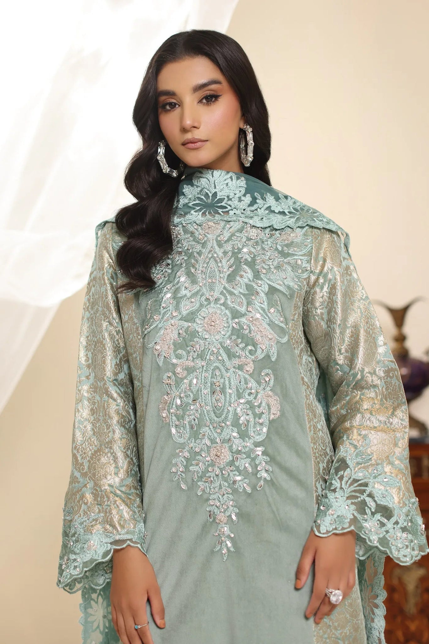 Model wearing Musferah Saad Sage Queen dress from the Amor a La Vida collection in light sage with intricate embroidery, perfect for Pakistani wedding clothes online in the UK.