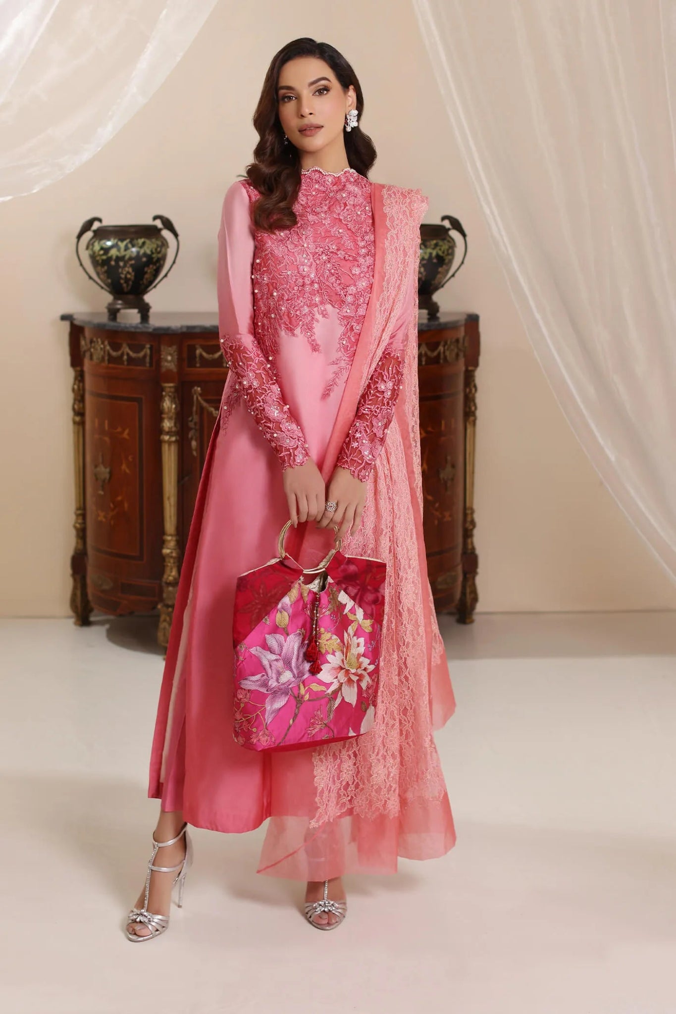 Model wearing Musferah Saad Whisper Noir dress in soft pink from the Amor a La Vida collection, showcasing intricate lace details. Ideal for Pakistani wedding clothes online in the UK.