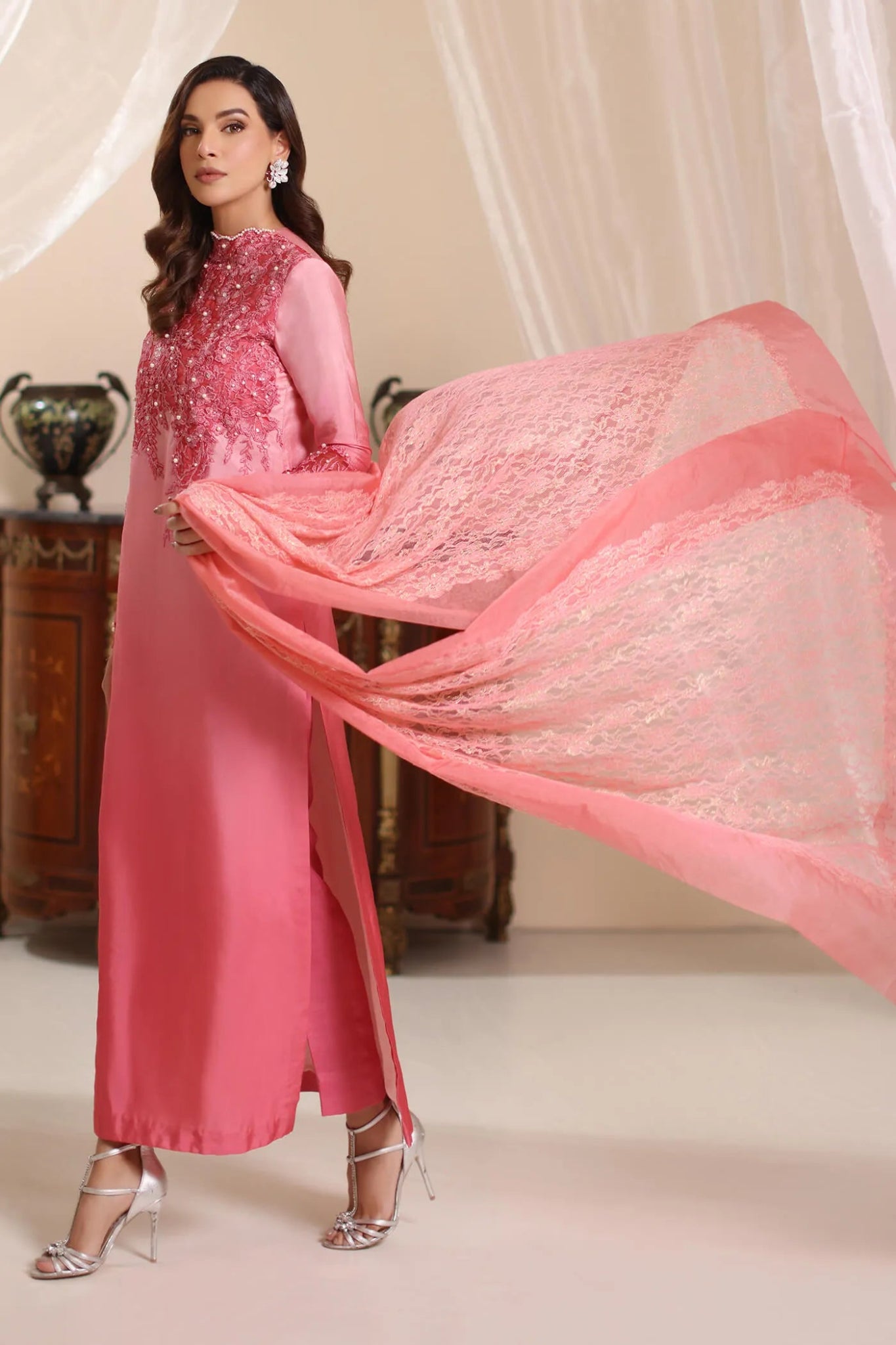 Model wearing Musferah Saad Whisper Noir dress in soft pink from the Amor a La Vida collection, showcasing intricate lace details. Ideal for Pakistani wedding clothes online in the UK.