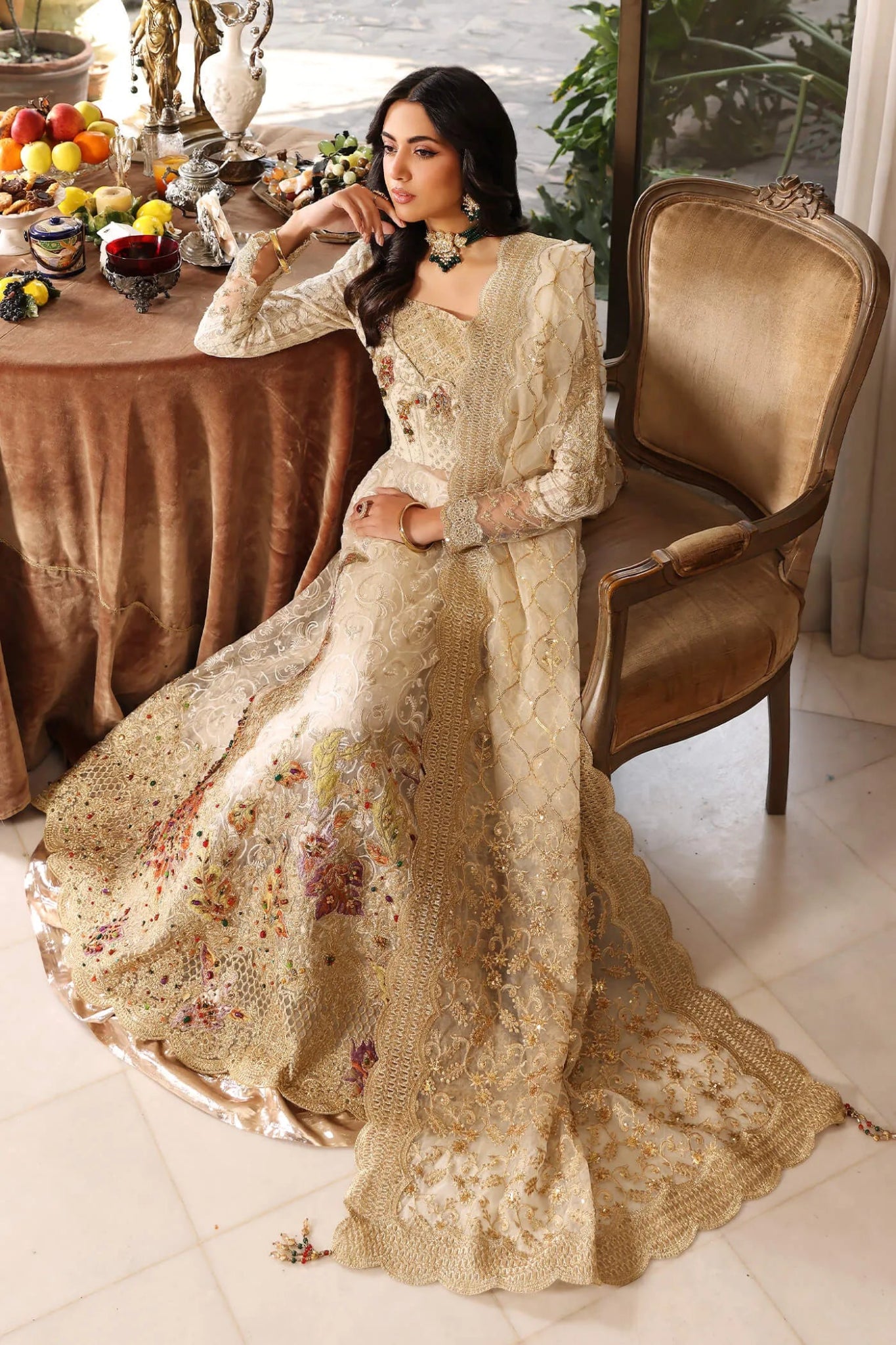 Model wearing a light ivory FLORAL MIST dress from Musferah Saad's ENCHANTE Eid collection '24, showcasing Pakistani clothes online in the UK.