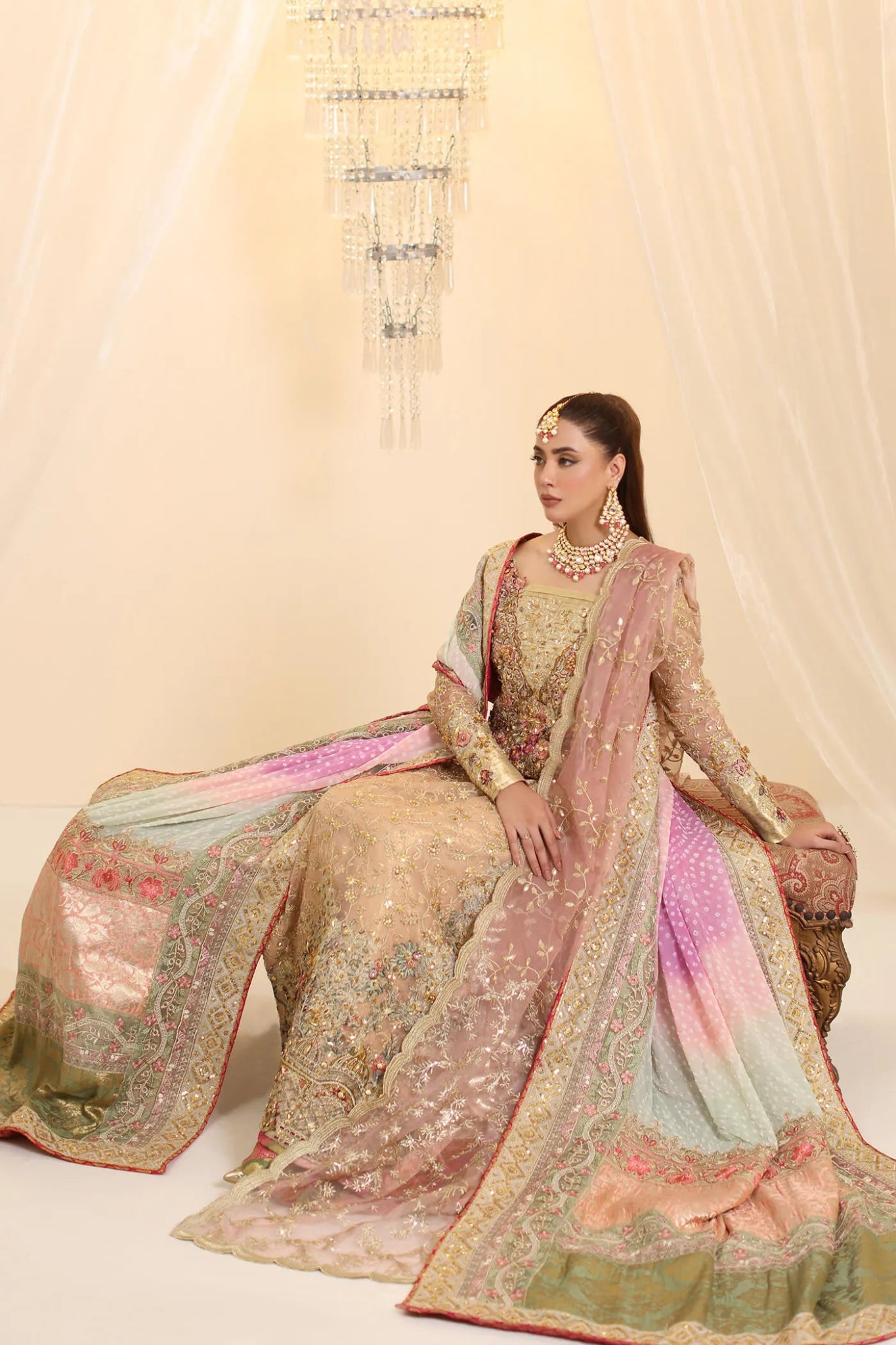 Model wearing Musferah Saad Coral Haze dress in peach and gold from the Ethereal Dream Formals collection, ideal for Pakistani wedding clothes online in the UK.