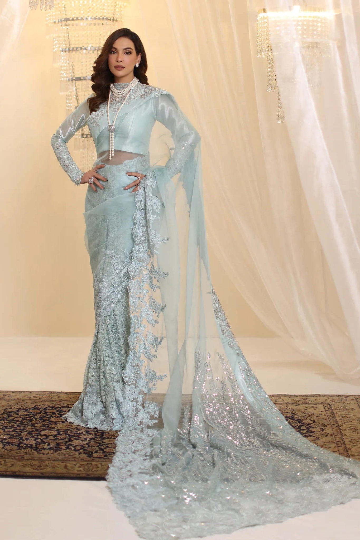 Model wearing Musferah Saad Crystal Maiden saree in pastel blue from the Ethereal Dream Formals collection, ideal for Pakistani wedding clothes online in the UK.