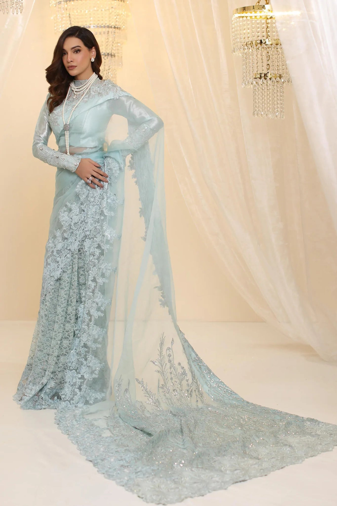 Model wearing Musferah Saad Crystal Maiden saree in pastel blue from the Ethereal Dream Formals collection, ideal for Pakistani wedding clothes online in the UK.