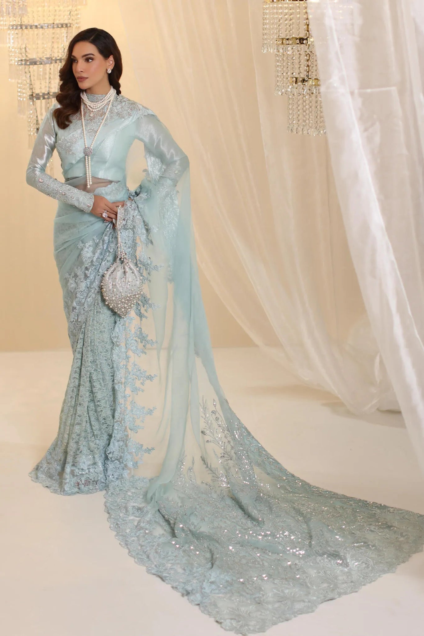 Model wearing Musferah Saad Crystal Maiden saree in pastel blue from the Ethereal Dream Formals collection, ideal for Pakistani wedding clothes online in the UK.