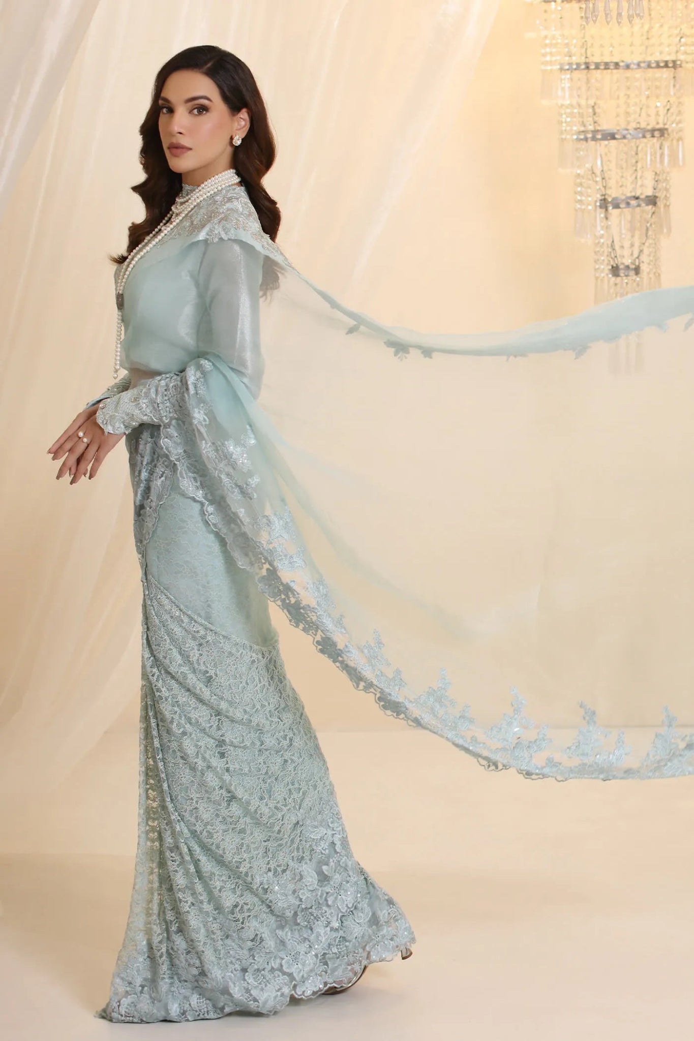 Model wearing Musferah Saad Crystal Maiden saree in pastel blue from the Ethereal Dream Formals collection, ideal for Pakistani wedding clothes online in the UK.