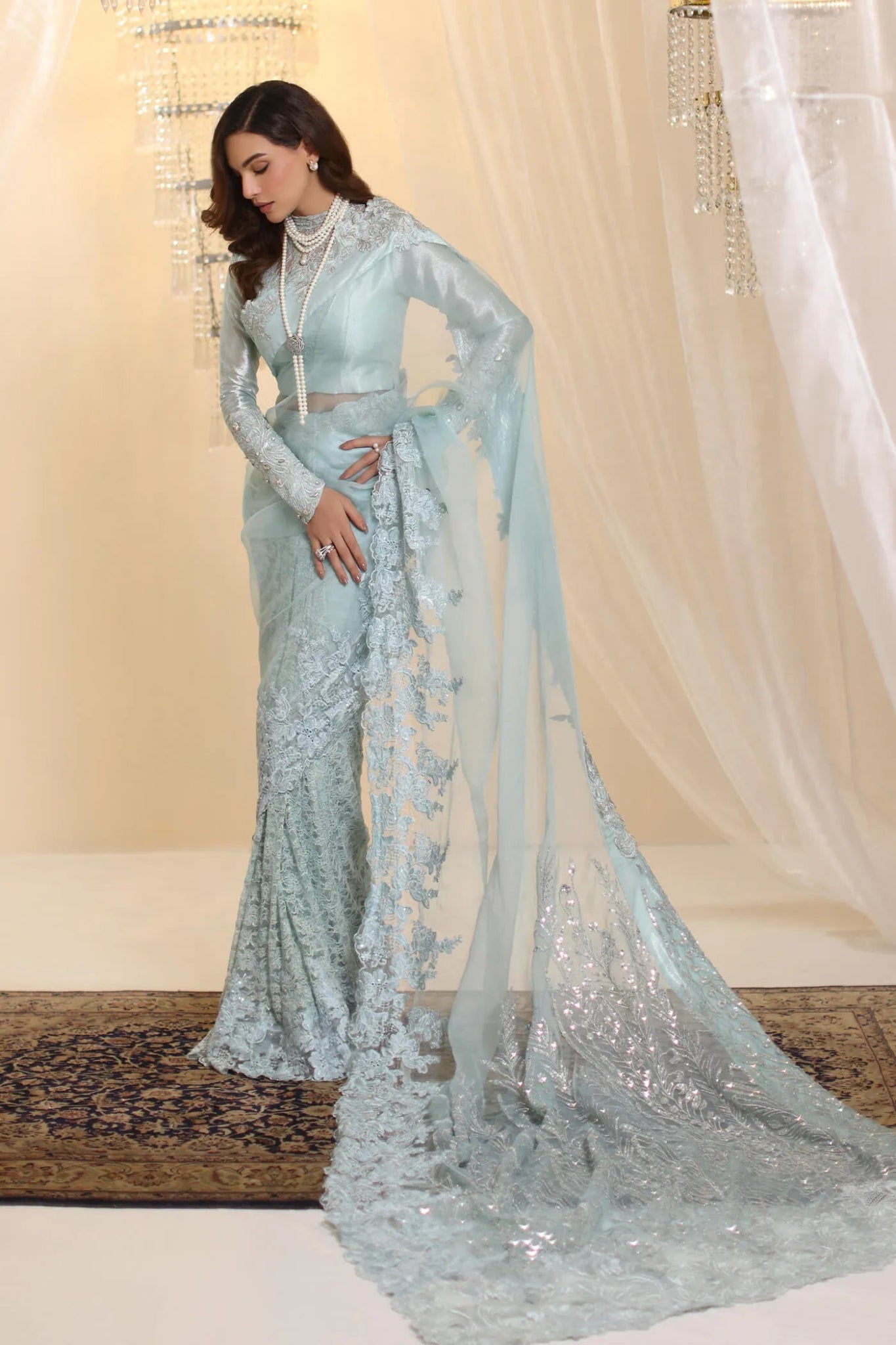 Model wearing Musferah Saad Crystal Maiden saree in pastel blue from the Ethereal Dream Formals collection, ideal for Pakistani wedding clothes online in the UK.