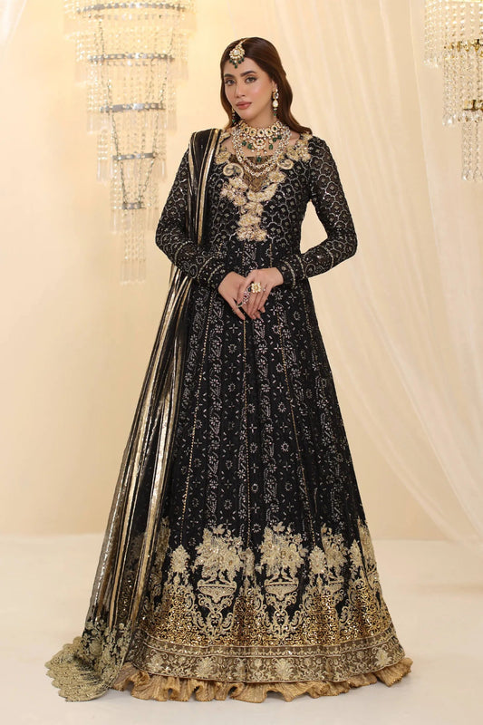 Model wearing Musferah Saad Enchantment dress in black and gold from the Ethereal Dream Formals collection, perfect for Pakistani wedding clothes online in the UK.