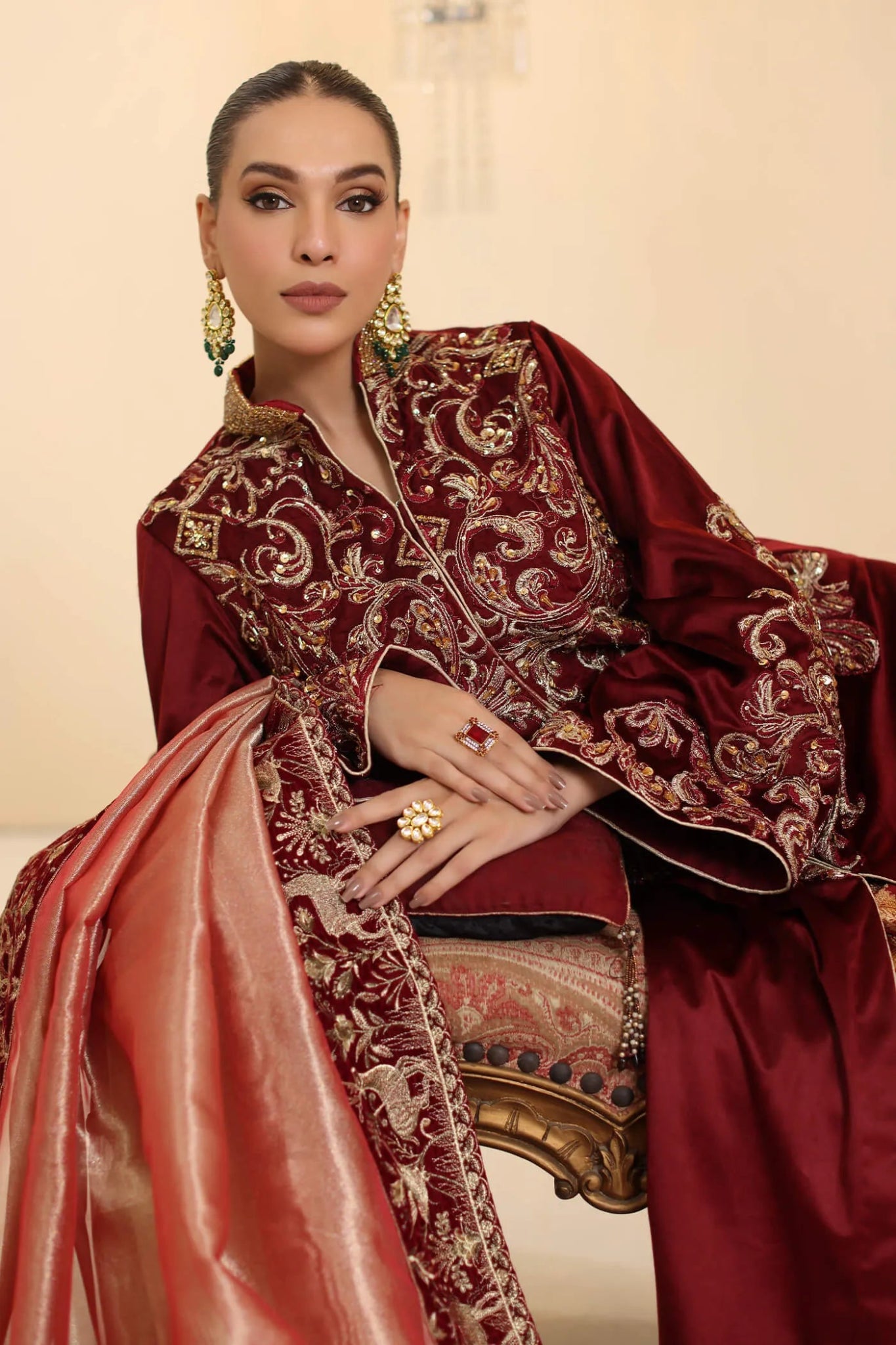 Model wearing Musferah Saad Grand Symphony dress in deep maroon from the Ethereal Dream Formals collection, ideal for Pakistani wedding clothes online in the UK.