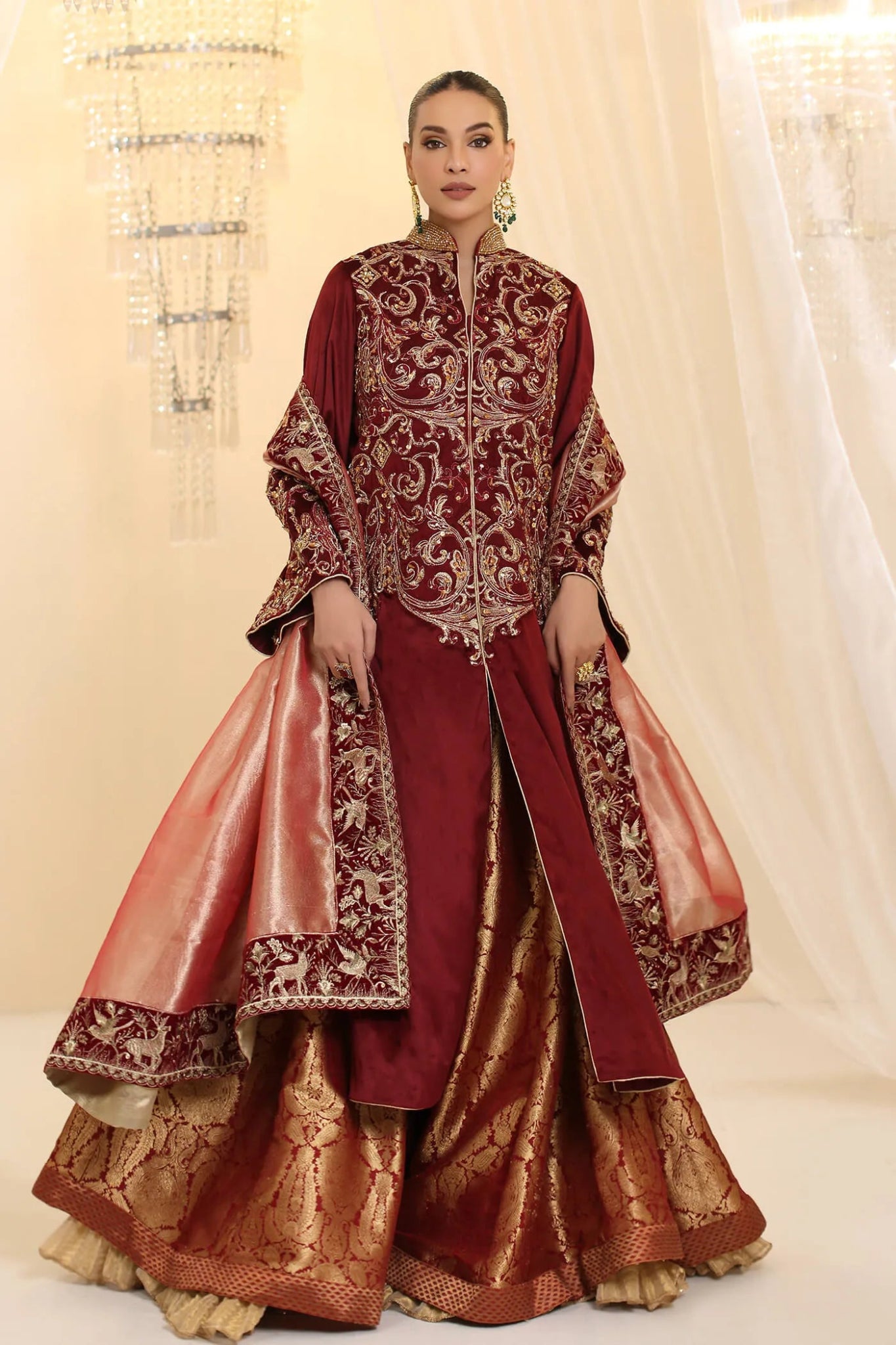 Model wearing Musferah Saad Grand Symphony dress in deep maroon from the Ethereal Dream Formals collection, ideal for Pakistani wedding clothes online in the UK.